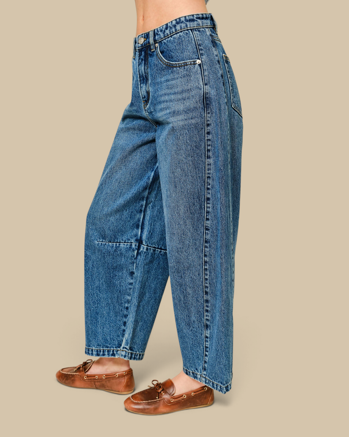 Homestyle Collective mid-rise cropped barrel jeans in medium wash denim with seam detailing and wide leg silhouette.
