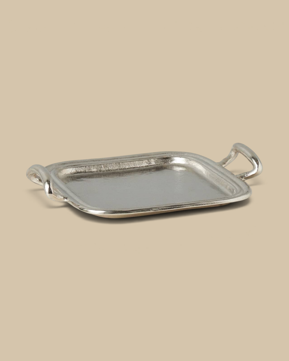 Homestyle Collective silver metal hotel tray with vintage-inspired handles on a marble surface