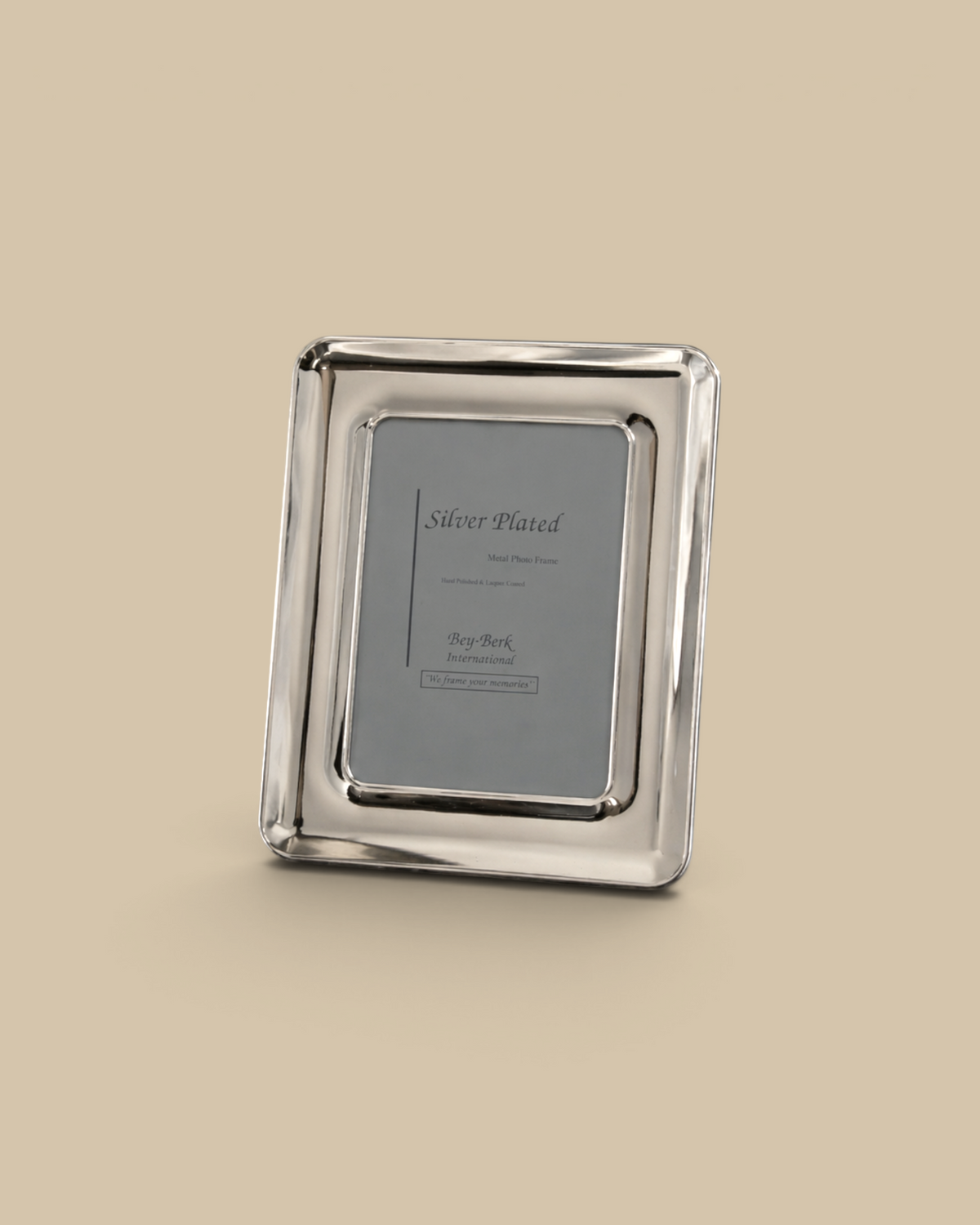 Homestyle Collective 4x6 silver-plated picture frame with a polished finish displayed on a dark marble surface.