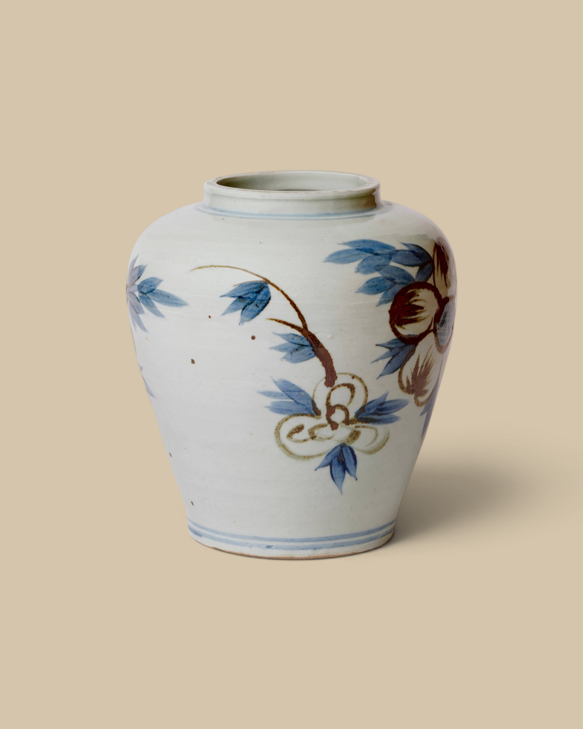 Homestyle Collective hand-painted porcelain vase featuring blue and brown sunflower motifs on a white background