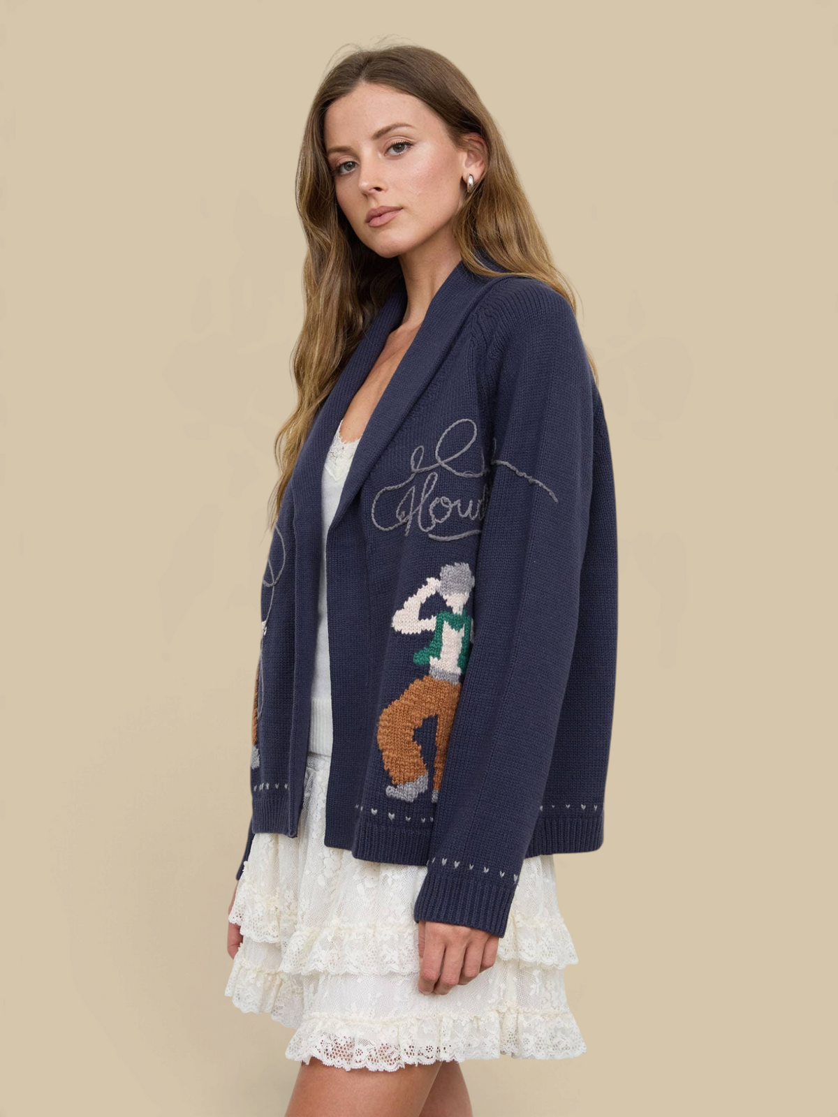 Homestyle Collective navy knit cardigan with Howdy Cowboy jacquard pattern, shawl collar, and relaxed fit on a model
