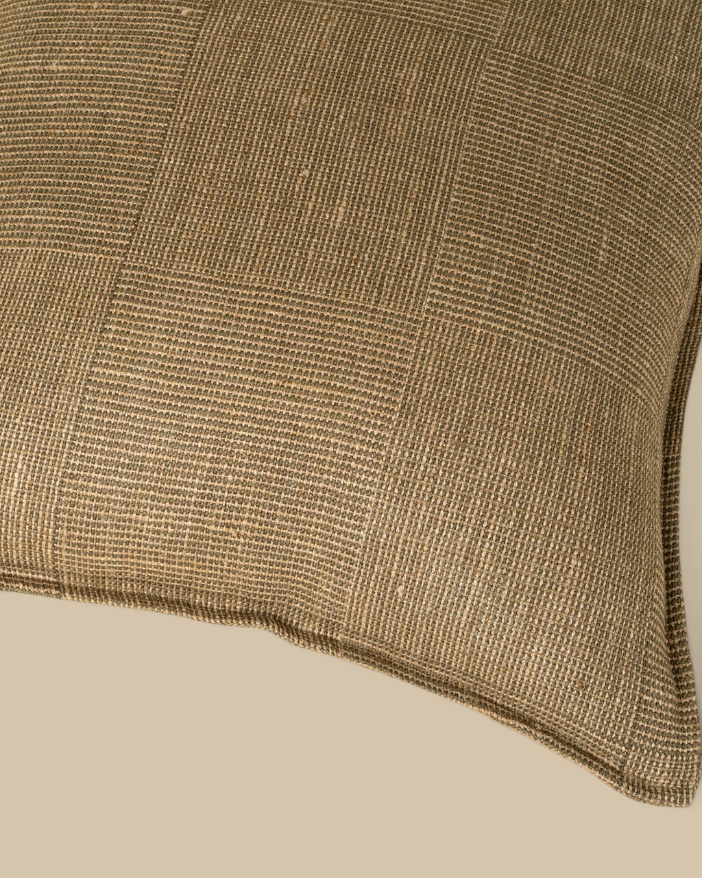 Homestyle Collective 20x20 olive green linen throw pillow with a textured patch weave pattern and flange detail.