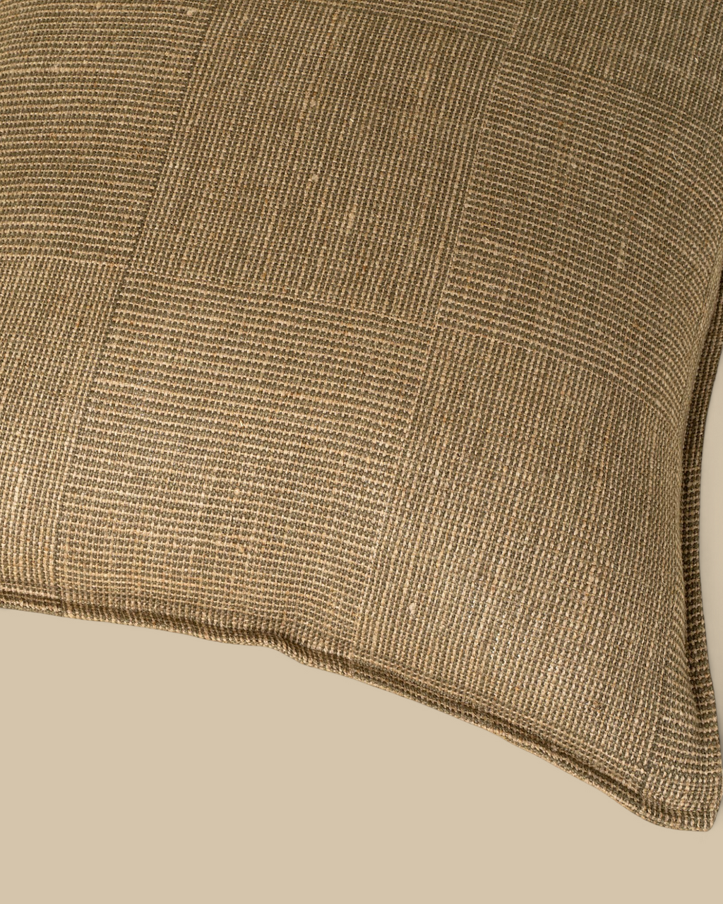 Homestyle Collective olive green 20x20 linen accent pillow with a textured patch weave and soft flange edge detail.
