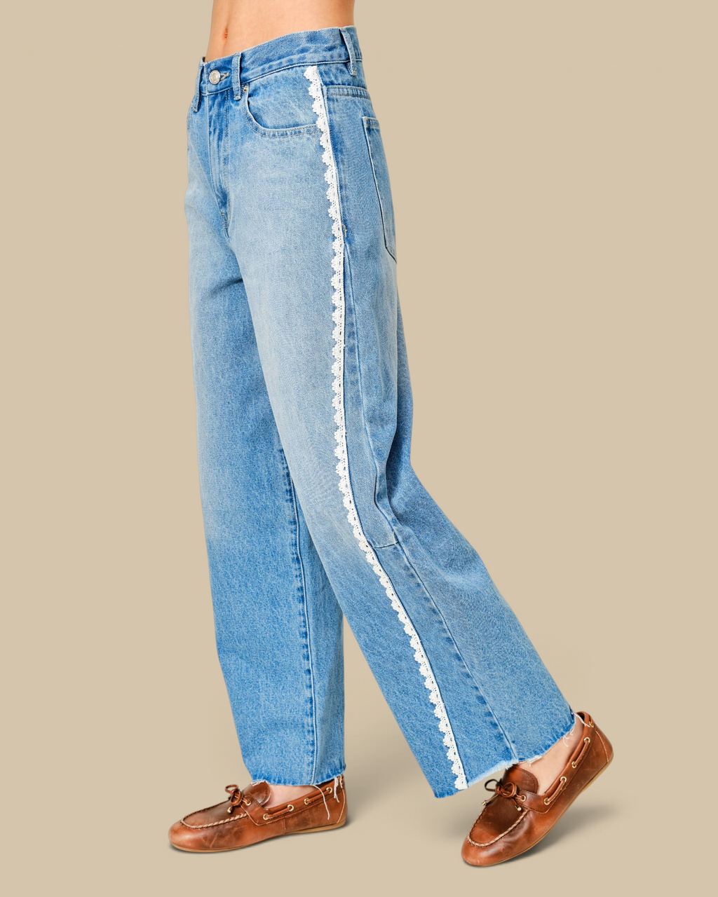 Homestyle Collective light wash denim jeans with a relaxed barrel silhouette and delicate white lace side trim.