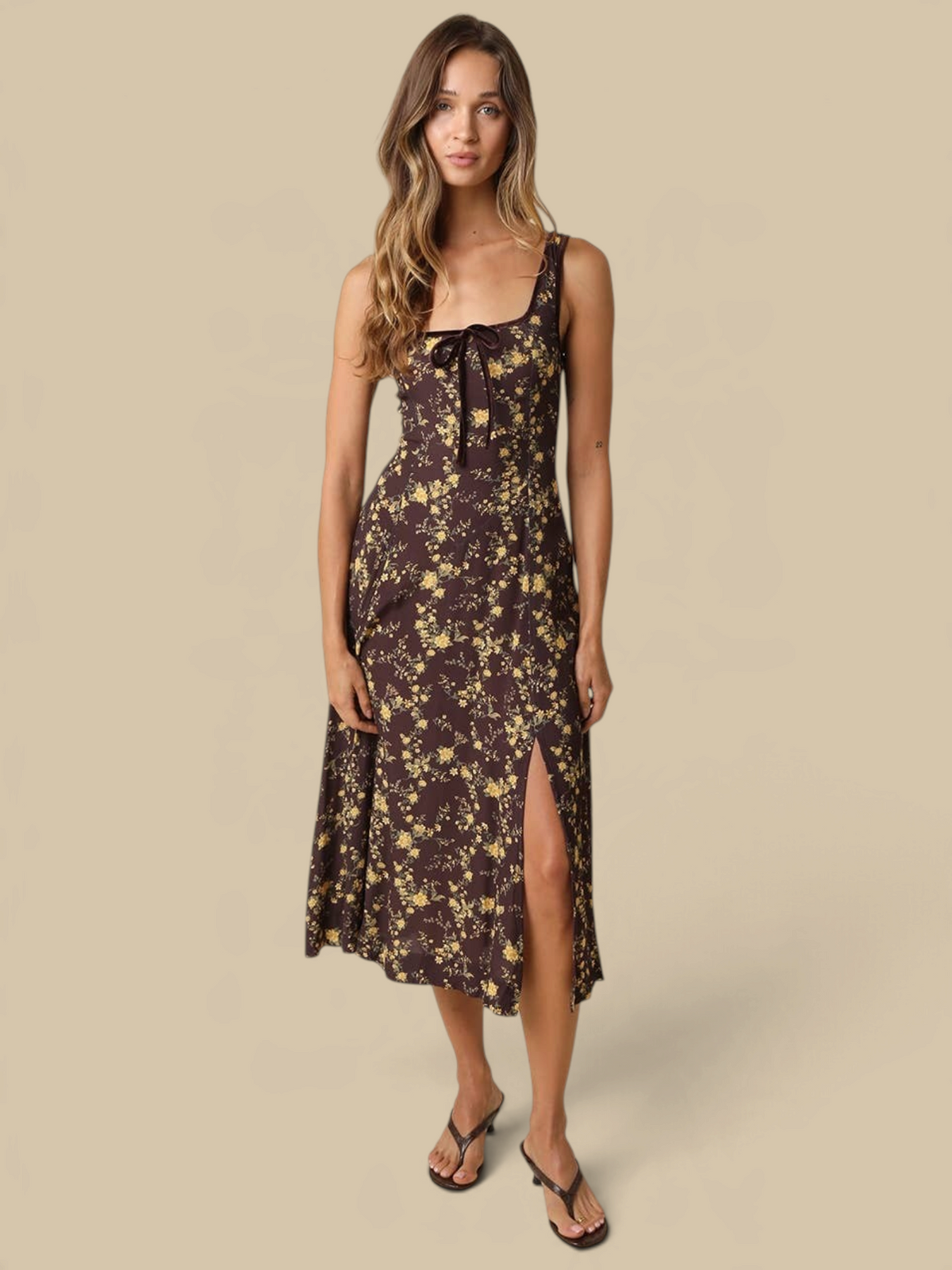 Homestyle Collective Sofia floral midi dress with square neckline, front bow, and side slit in brown and yellow