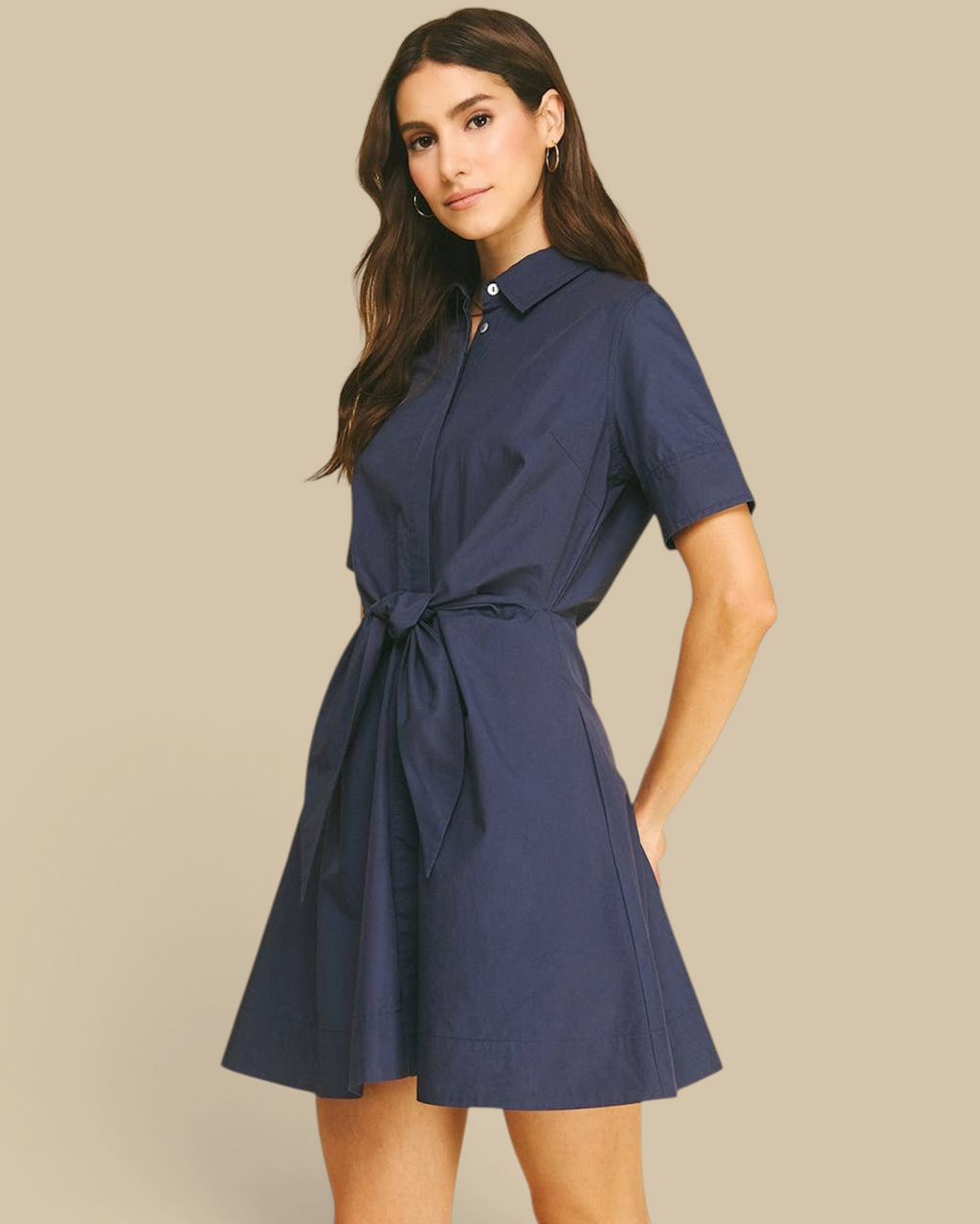 Homestyle Collective navy mini dress with a collar, short sleeves, and a tie-front waist detail on a model