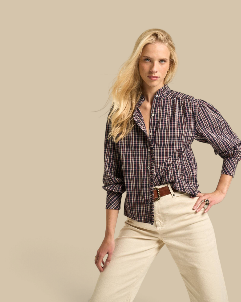 Homestyle Collective Alexa blouse in navy gingham cotton with a ruffled neckline and long sleeves on a blonde model.