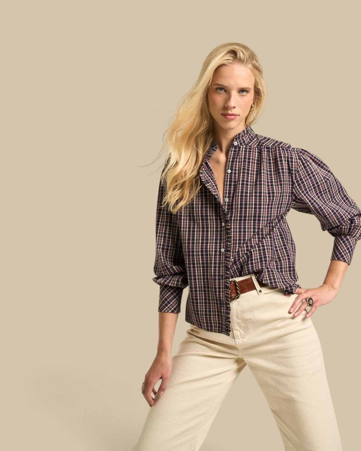 Homestyle Collective Alexa blouse in navy gingham cotton with a ruffled neckline and long sleeves on a blonde model.