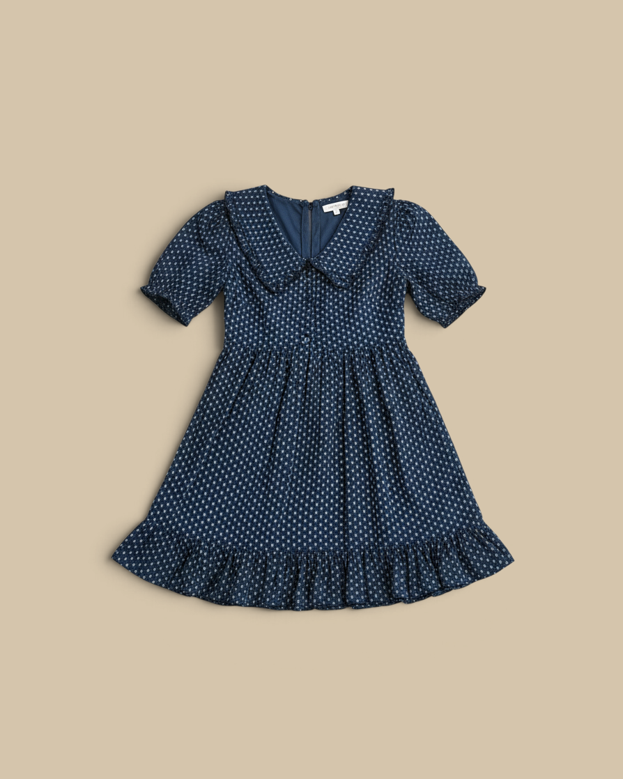 Homestyle Collective navy mini dress with puff sleeves, ruffled hem, collar, and button front in a floral print.