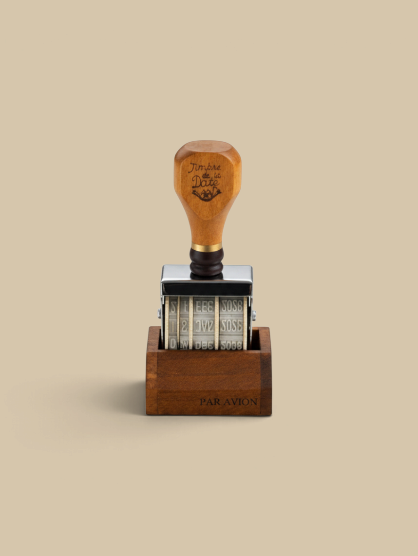 Homestyle Collective vintage-style wooden date stamp with adjustable rotating wheels and a sturdy wooden base.