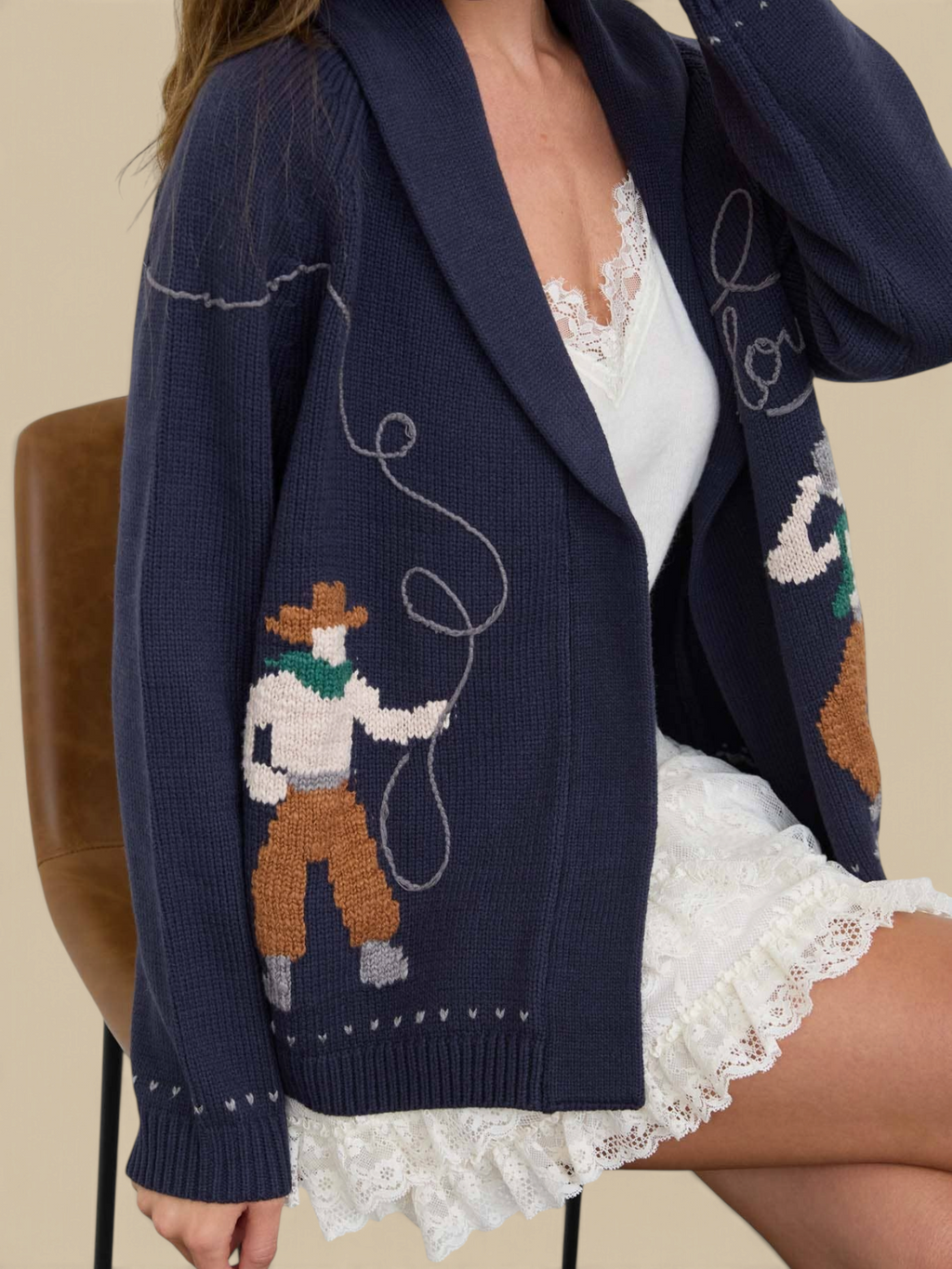 Homestyle Collective navy knit cardigan with Howdy Cowboy jacquard pattern, shawl collar, and relaxed open front fit.