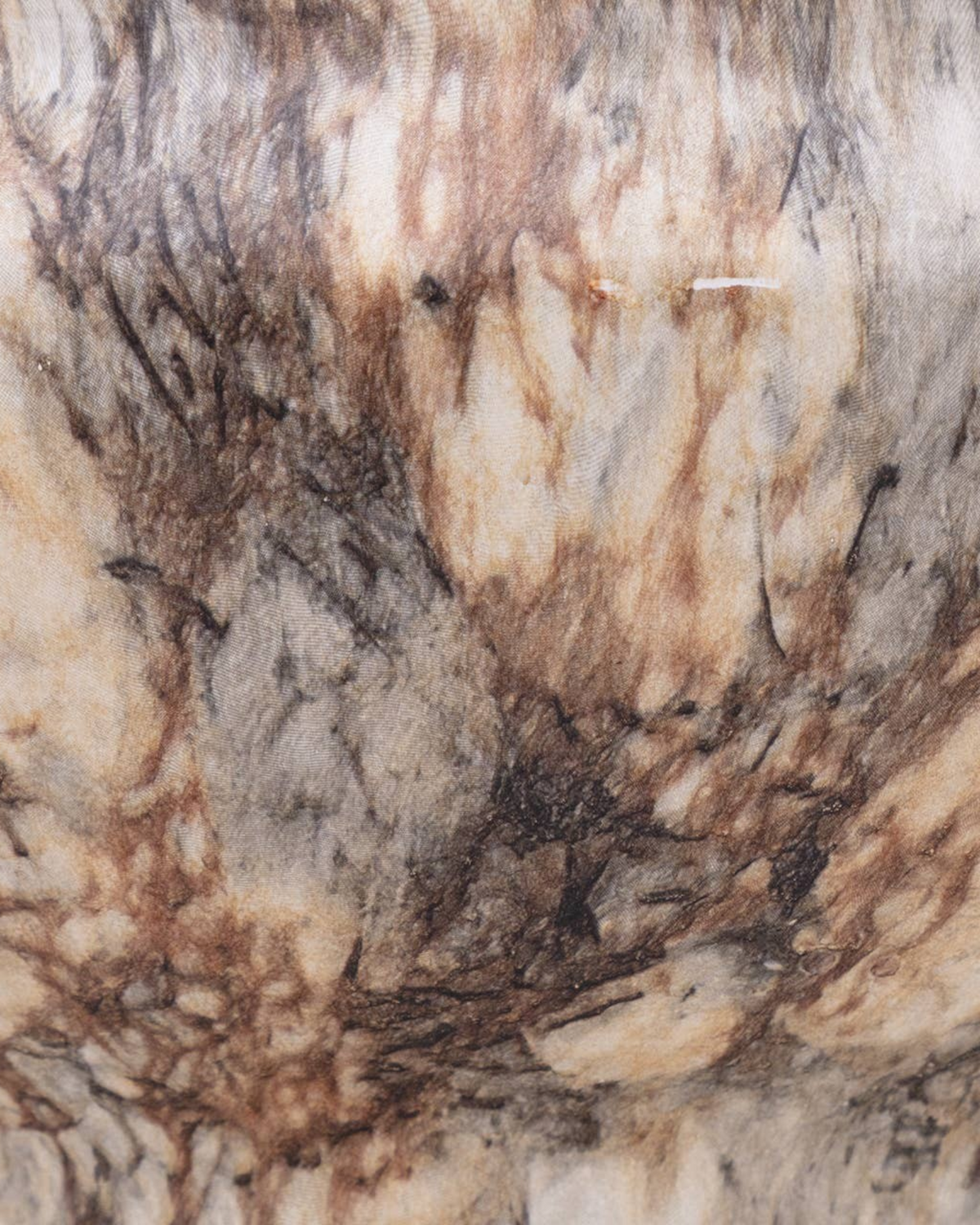 Homestyle Collective Fenmir ceramic bowl featuring a luxurious brown and beige marble pattern texture.