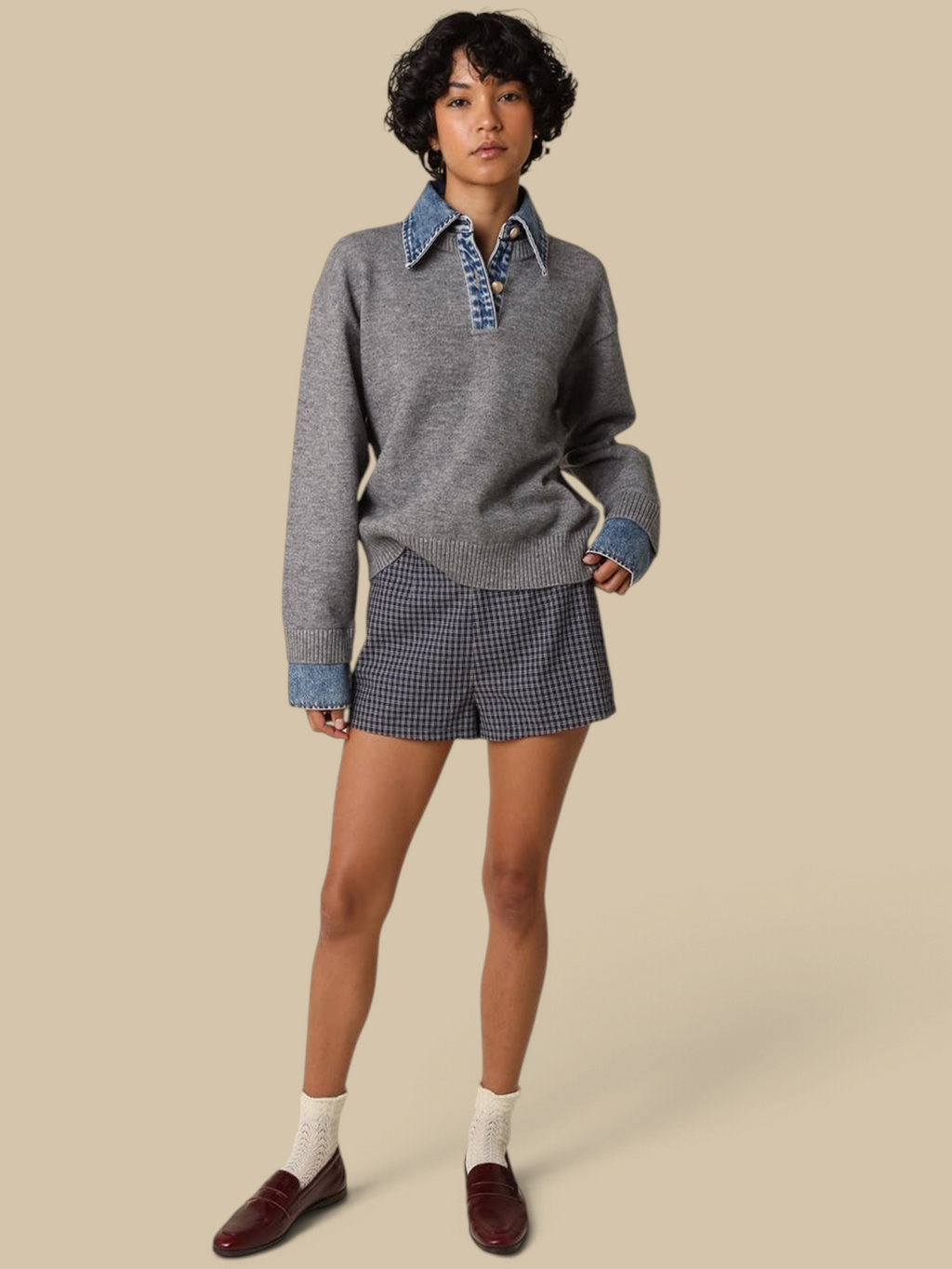 Model wearing Homestyle Collective Emely grey knit sweater with denim collar, cuffs, and gold button details.