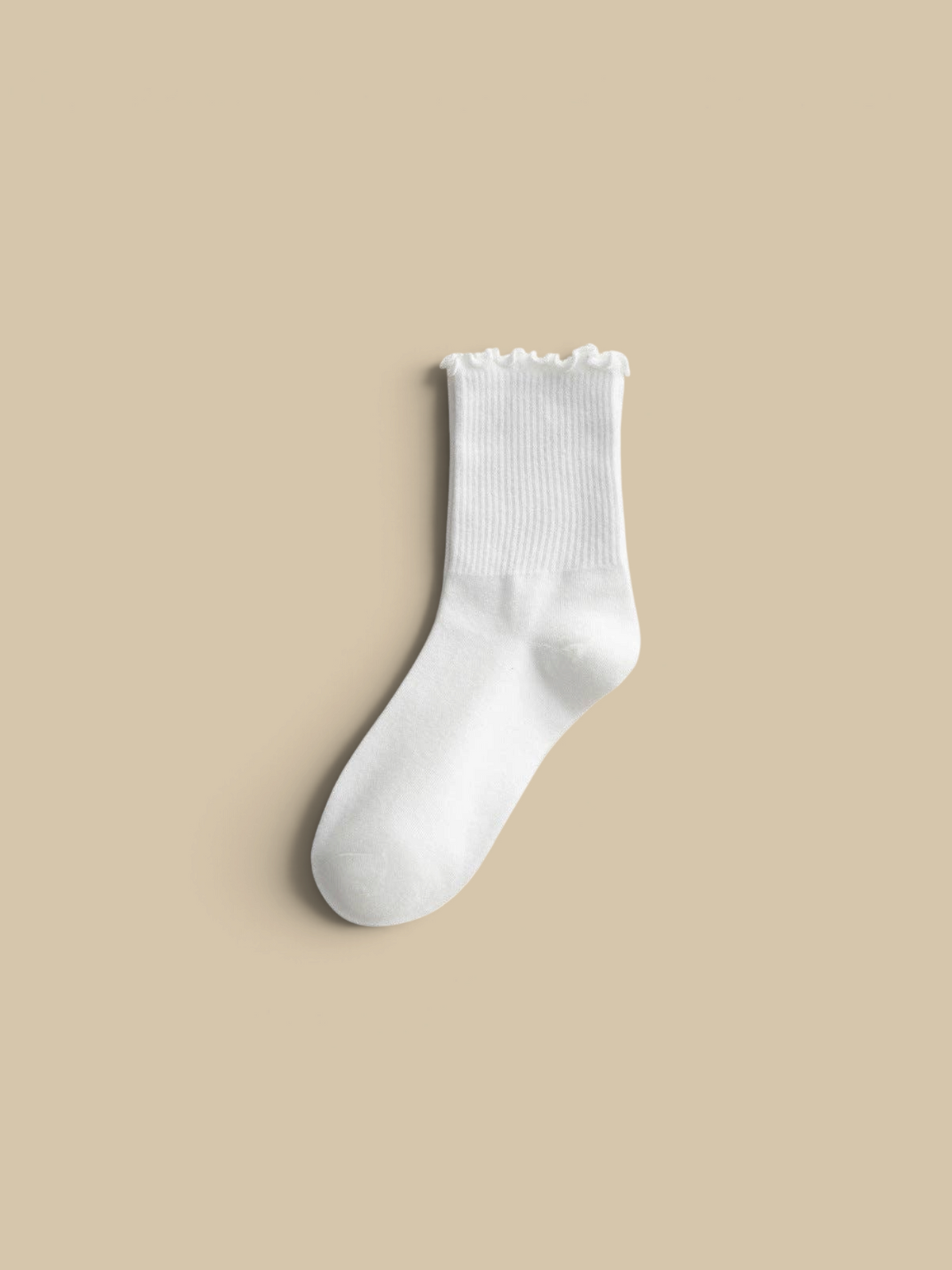 Homestyle Collective white ribbed socks with a delicate flounce ruffle cuff, made from a soft cotton-polyester blend.
