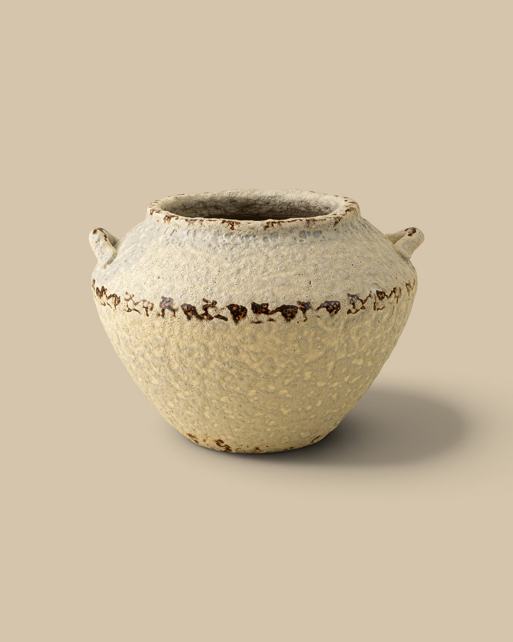 Homestyle Collective Terra terracotta vase with a rounded silhouette, weathered cream finish, and decorative handles.