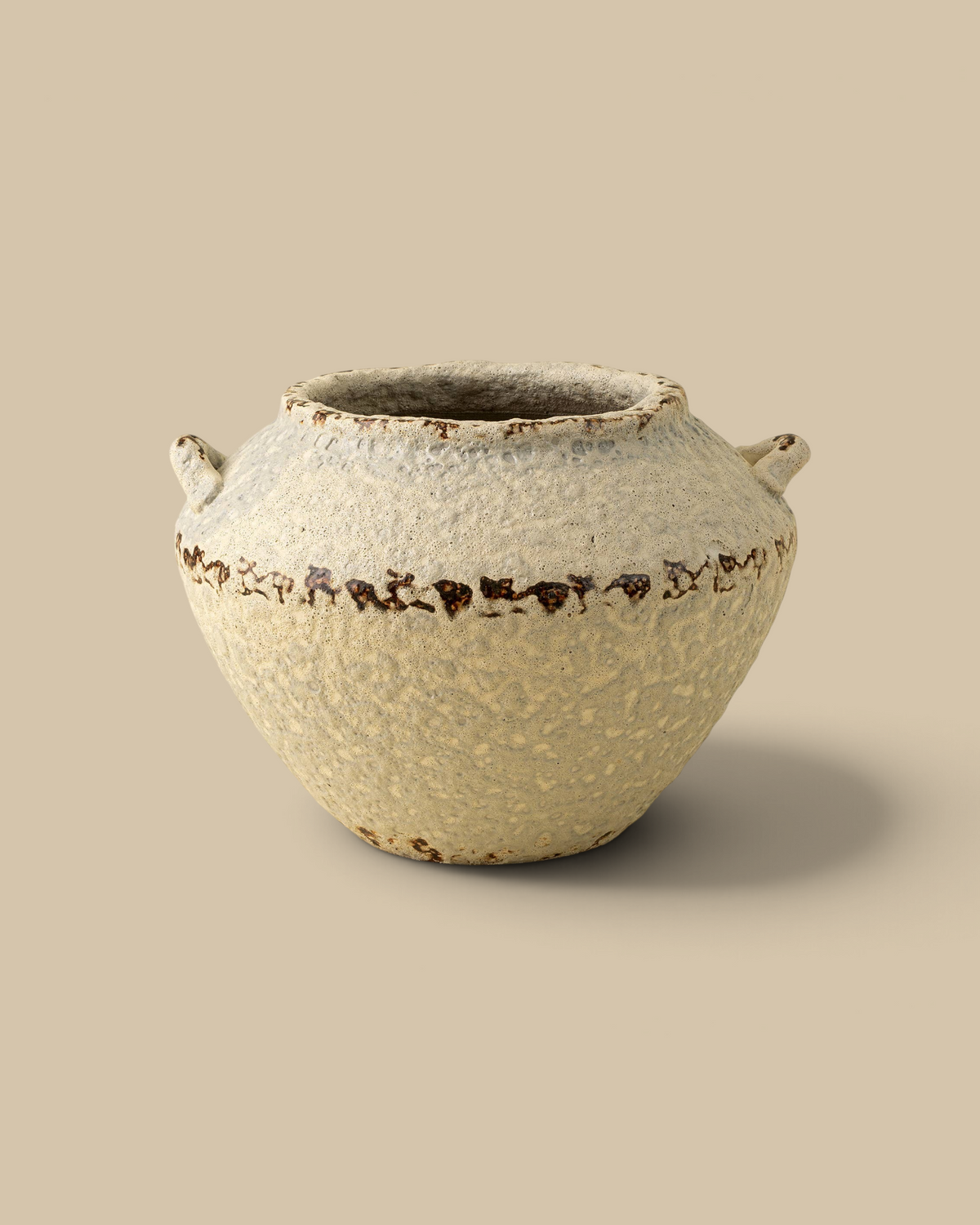 Homestyle Collective Terra terracotta vase with a rounded silhouette, weathered cream finish, and decorative handles.
