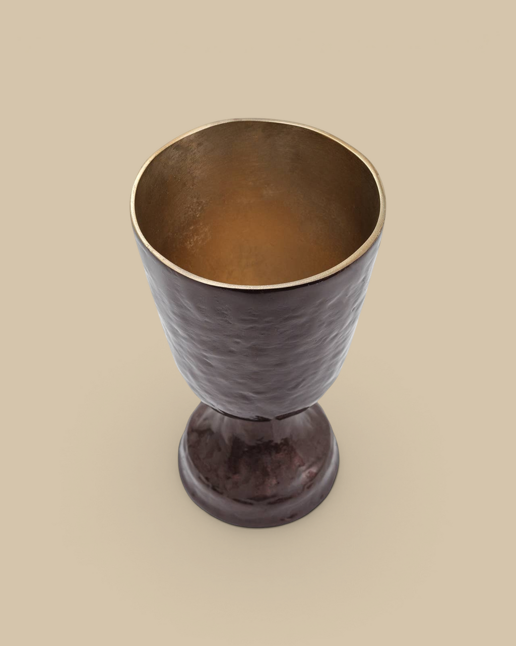 Homestyle Collective Verlix short urn in bronze aluminum with a textured finish and gold interior, top-down view.