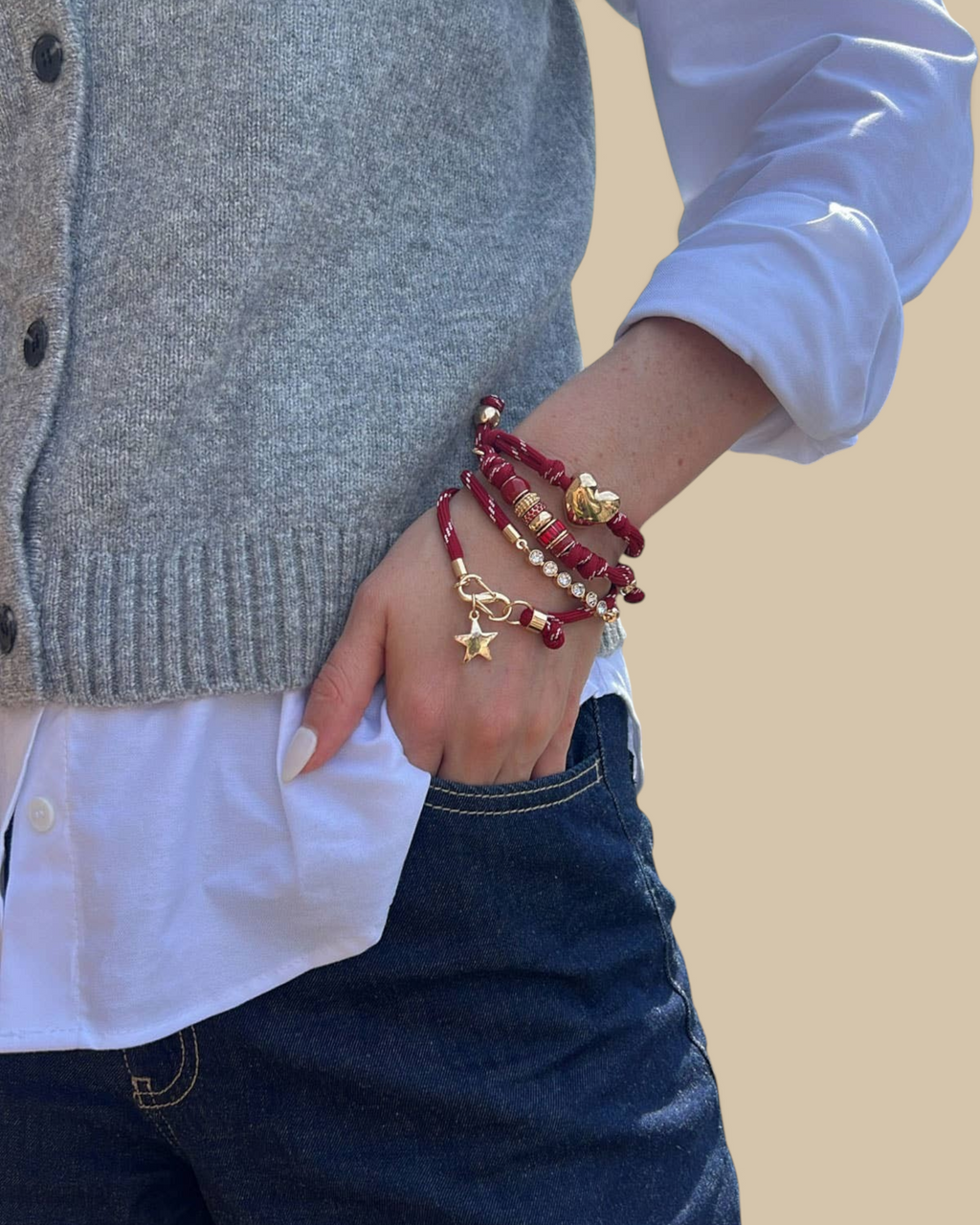 Homestyle Collective red paracord bracelet stack featuring a glossy puffy heart charm and a gold star charm