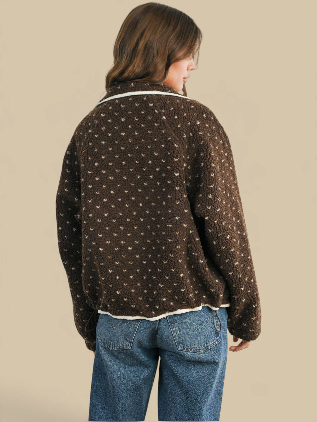 Homestyle Collective brown high pile fleece puffer jacket with white heart pattern worn by a woman from behind