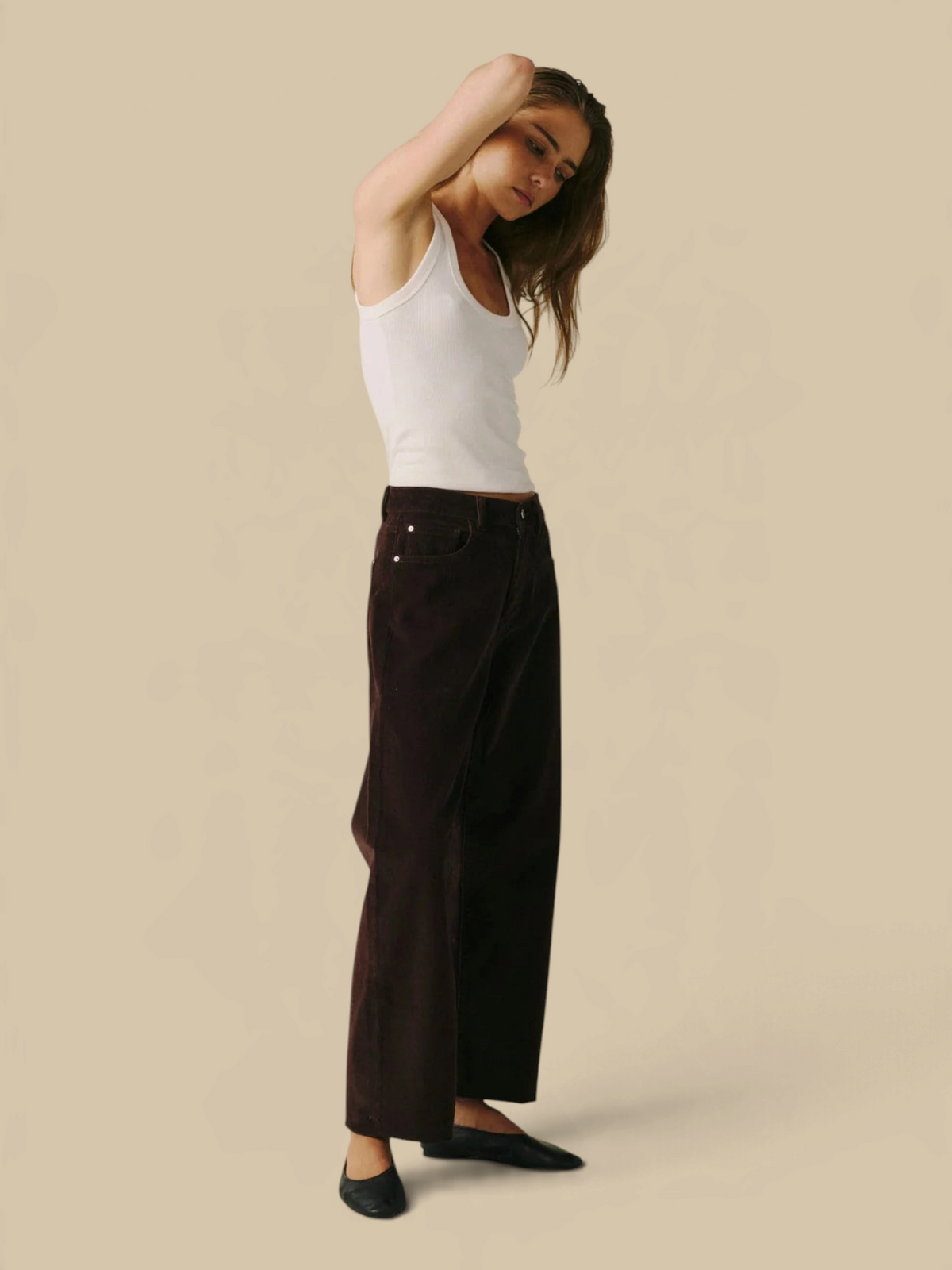 Homestyle Collective BNA soft curve barrel jeans in Americano brown corduroy worn by a model with a white tank top