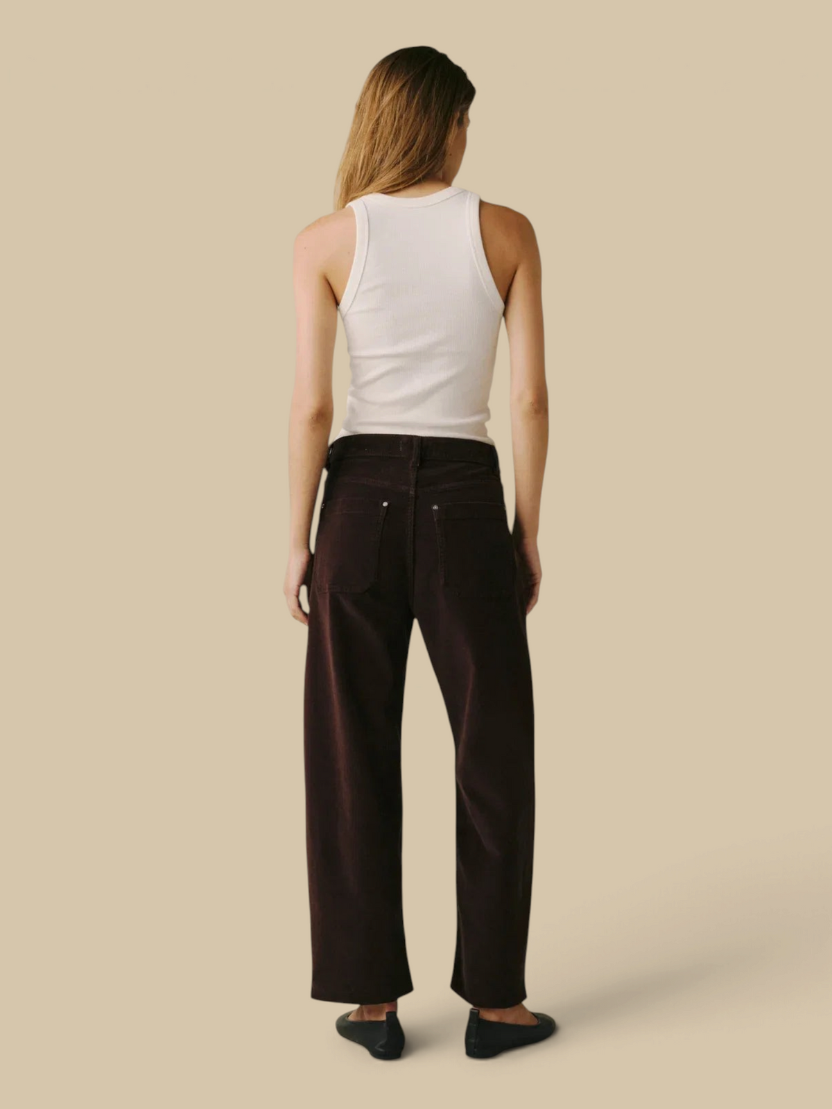 Homestyle Collective BNA soft curve barrel jeans in Americano brown corduroy, back view on a model.
