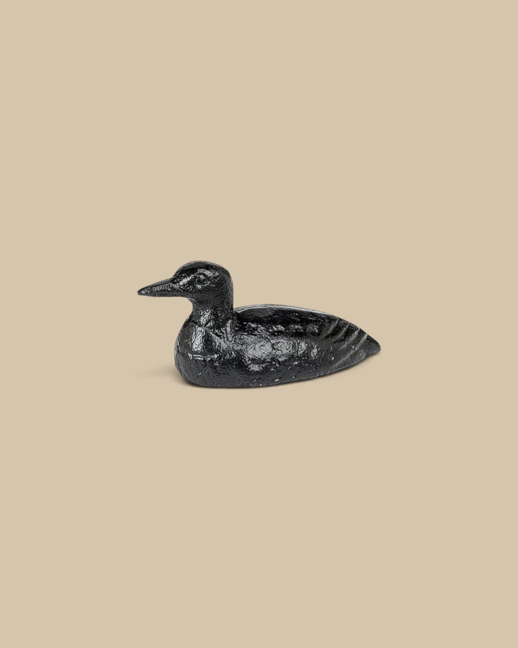 Homestyle Collective mini cast iron loon figurine with a matte black finish and detailed texture for home decor.