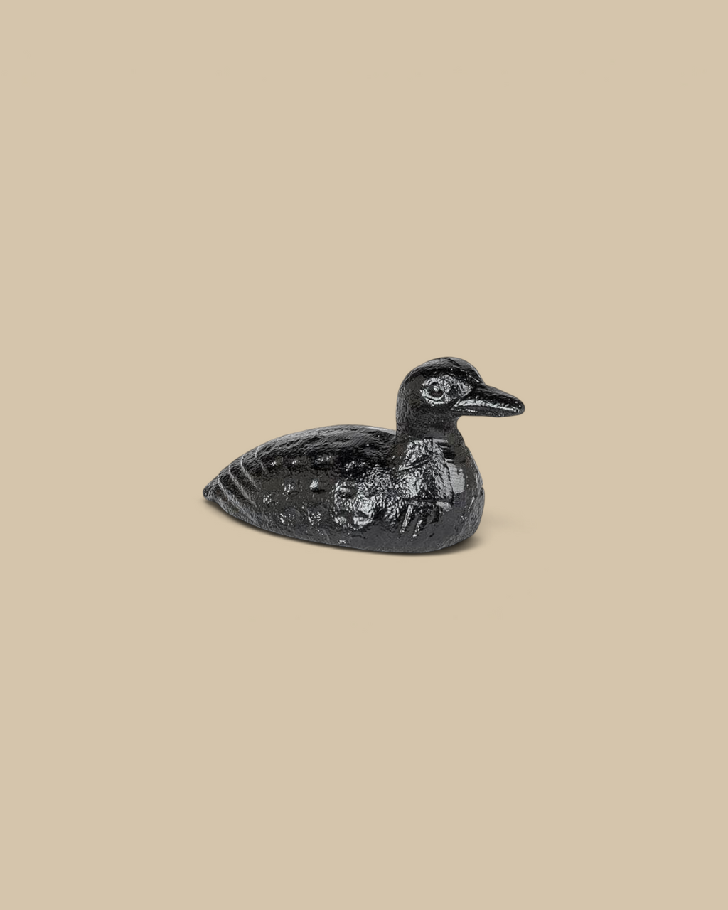 Homestyle Collective mini cast iron loon figurine with a matte black finish and detailed feather texture