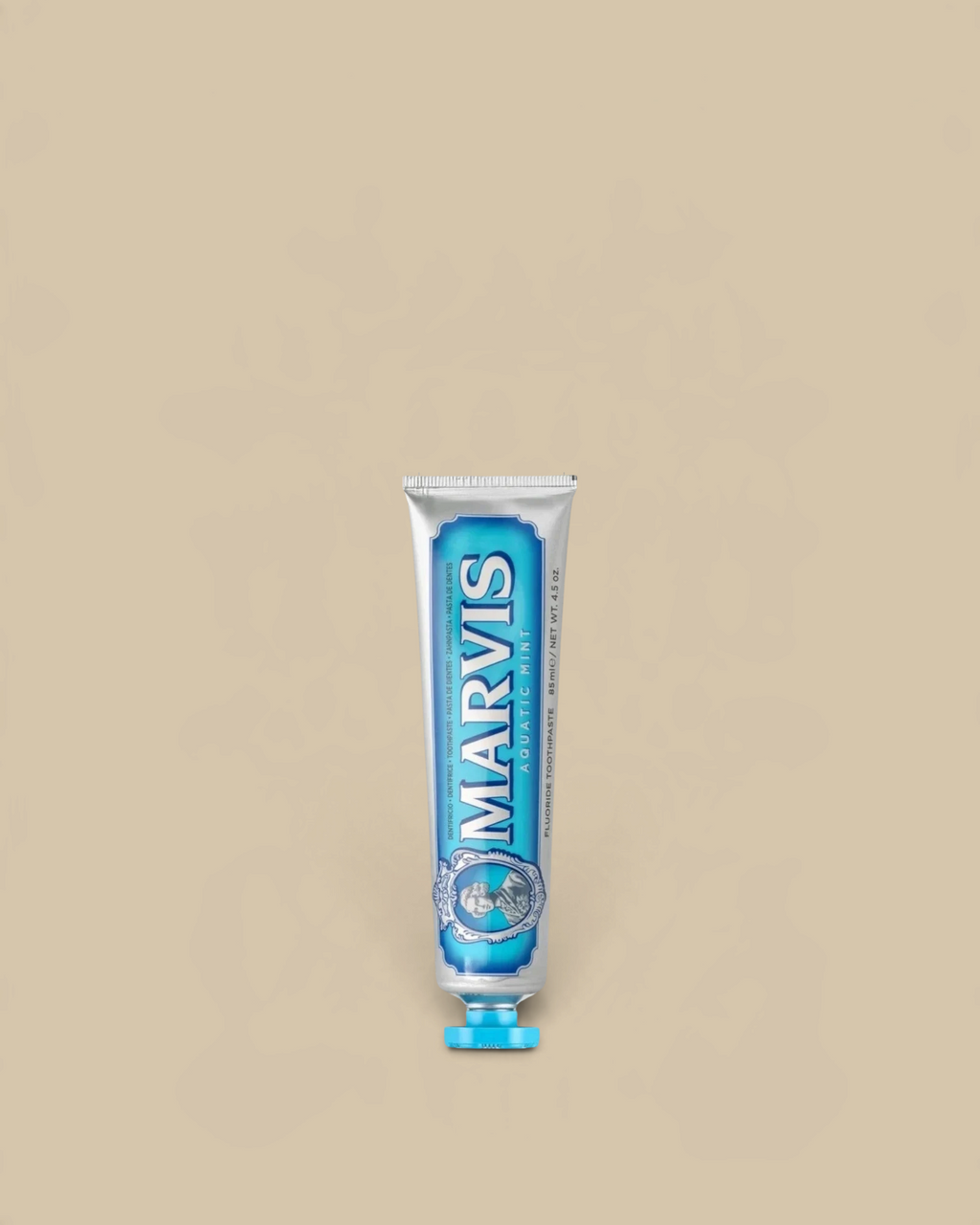 Homestyle Collective Marvis Aquatic Mint toothpaste in a silver travel-size tube with blue accents.