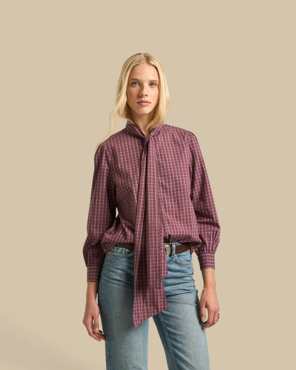 Homestyle Collective Lily Blouse in burgundy cotton gingham with a tie-neck detail worn by a blonde model.