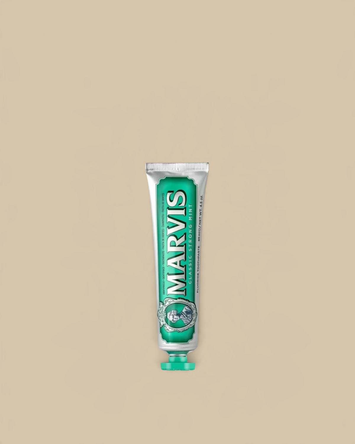 Homestyle Collective Marvis travel size toothpaste in a green and silver tube with classic strong mint flavor.