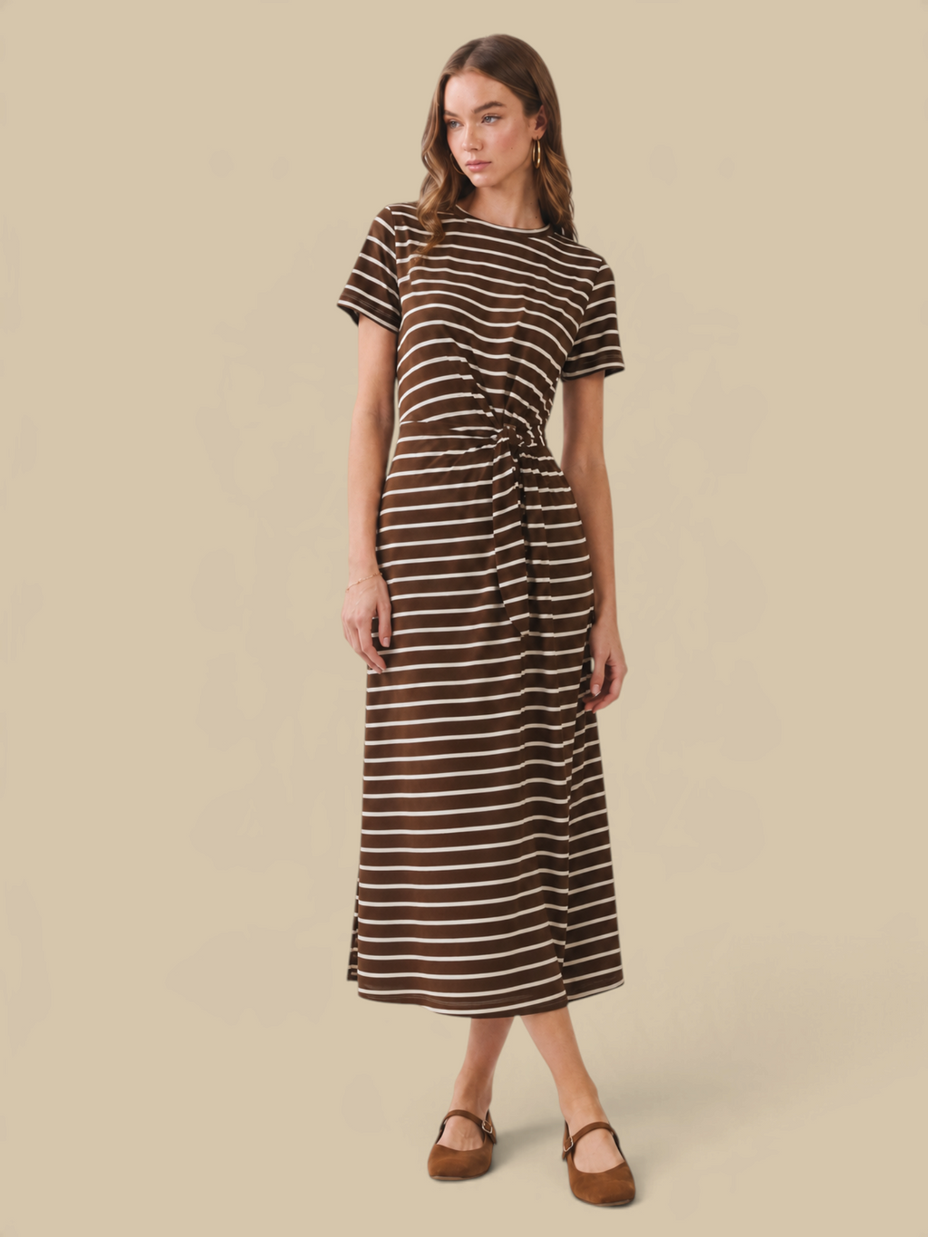 Model wearing Homestyle Collective chocolate brown and white striped jersey maxi dress with a waist tie detail.