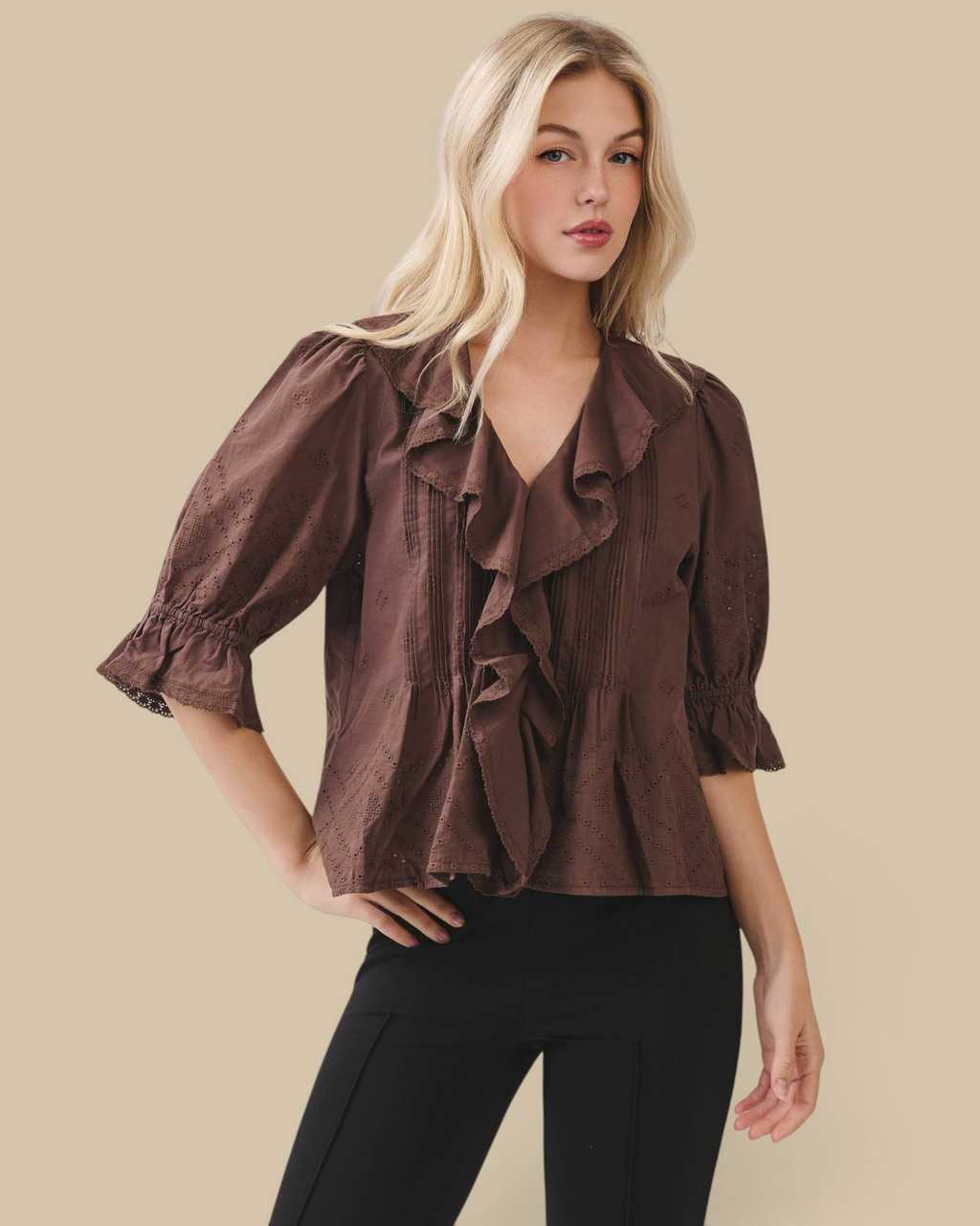 Homestyle Collective brown cotton eyelet blouse with ruffle front, pintuck pleating, and elbow-length puff sleeves.
