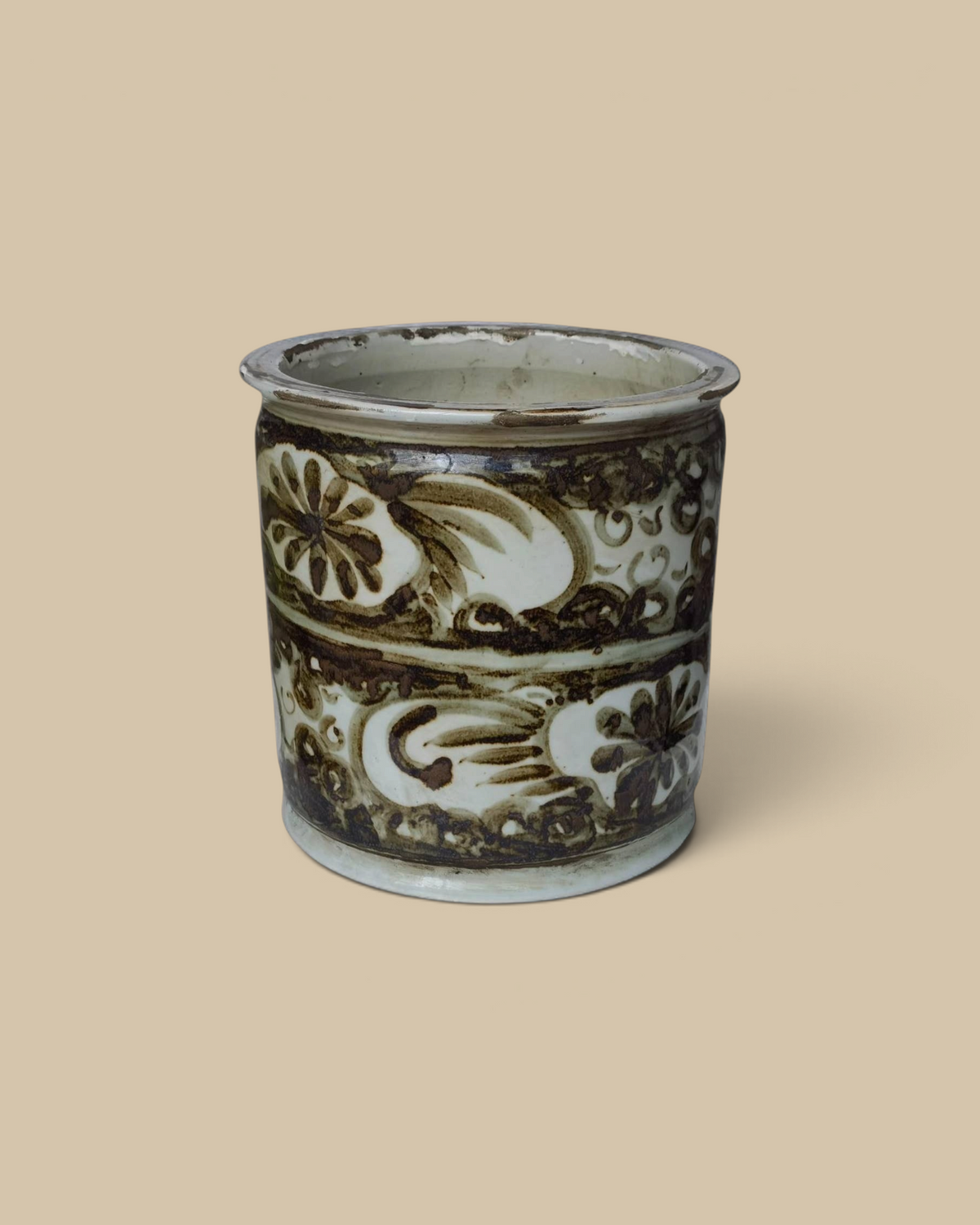 Homestyle Collective rustic brown hand-painted porcelain orchid pot with a decorative sea flower motif