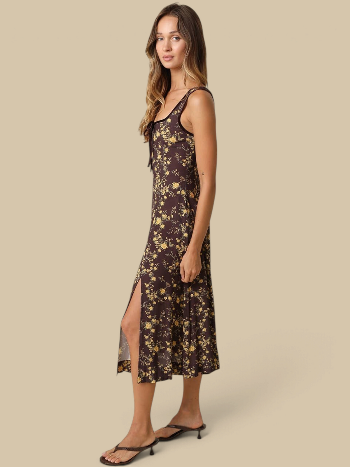 Homestyle Collective Sofia floral midi dress in brown with yellow flowers, square neckline, and side slit on a model