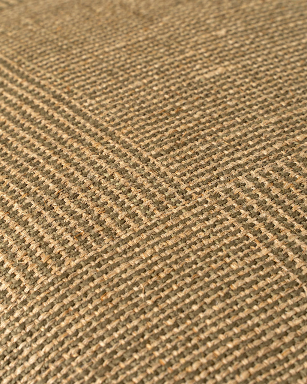 Homestyle Collective olive green 20x20 linen throw pillow featuring a detailed patch weave texture.