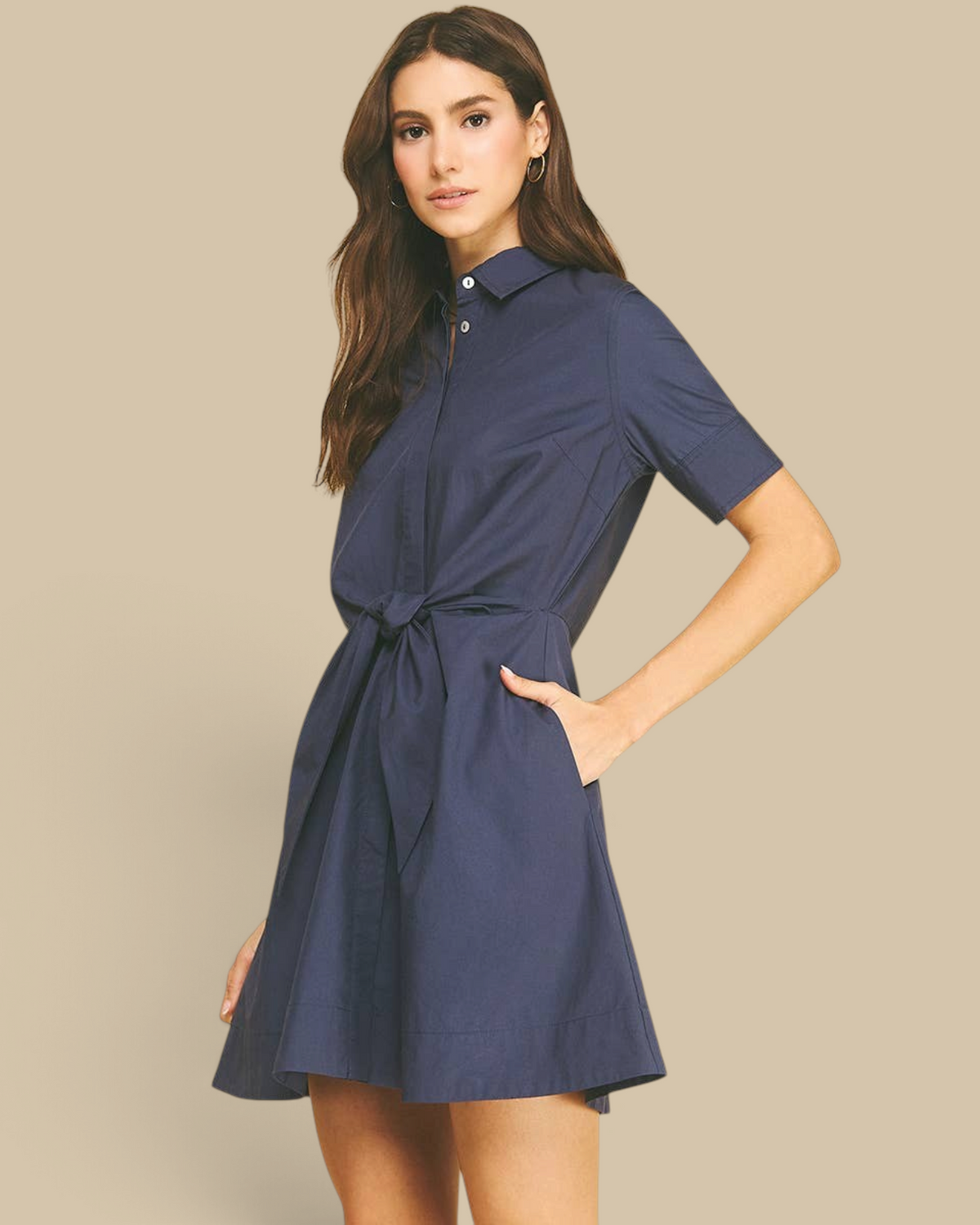 Homestyle Collective navy mini dress with a collar, short sleeves, and a tie-front waist detail on a model.