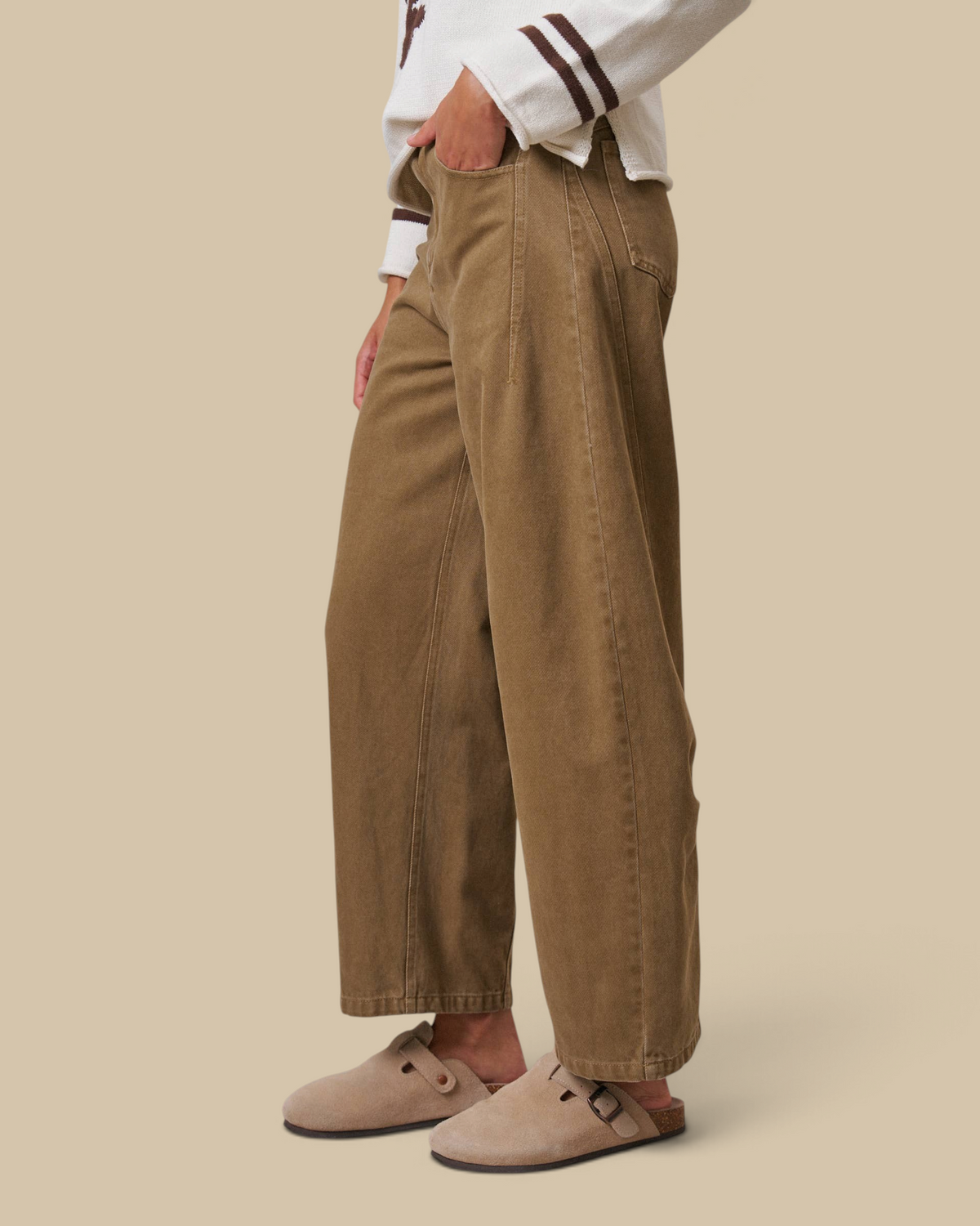 Homestyle Collective tan cotton barrel leg pants with a high-rise fit and cropped ankle, side profile view.