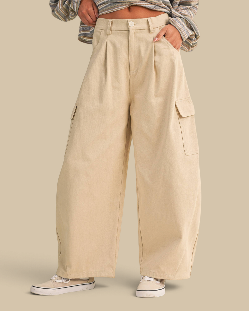 Homestyle Collective beige cotton twill high-waisted cargo barrel pants with a wide-leg fit and side pockets.