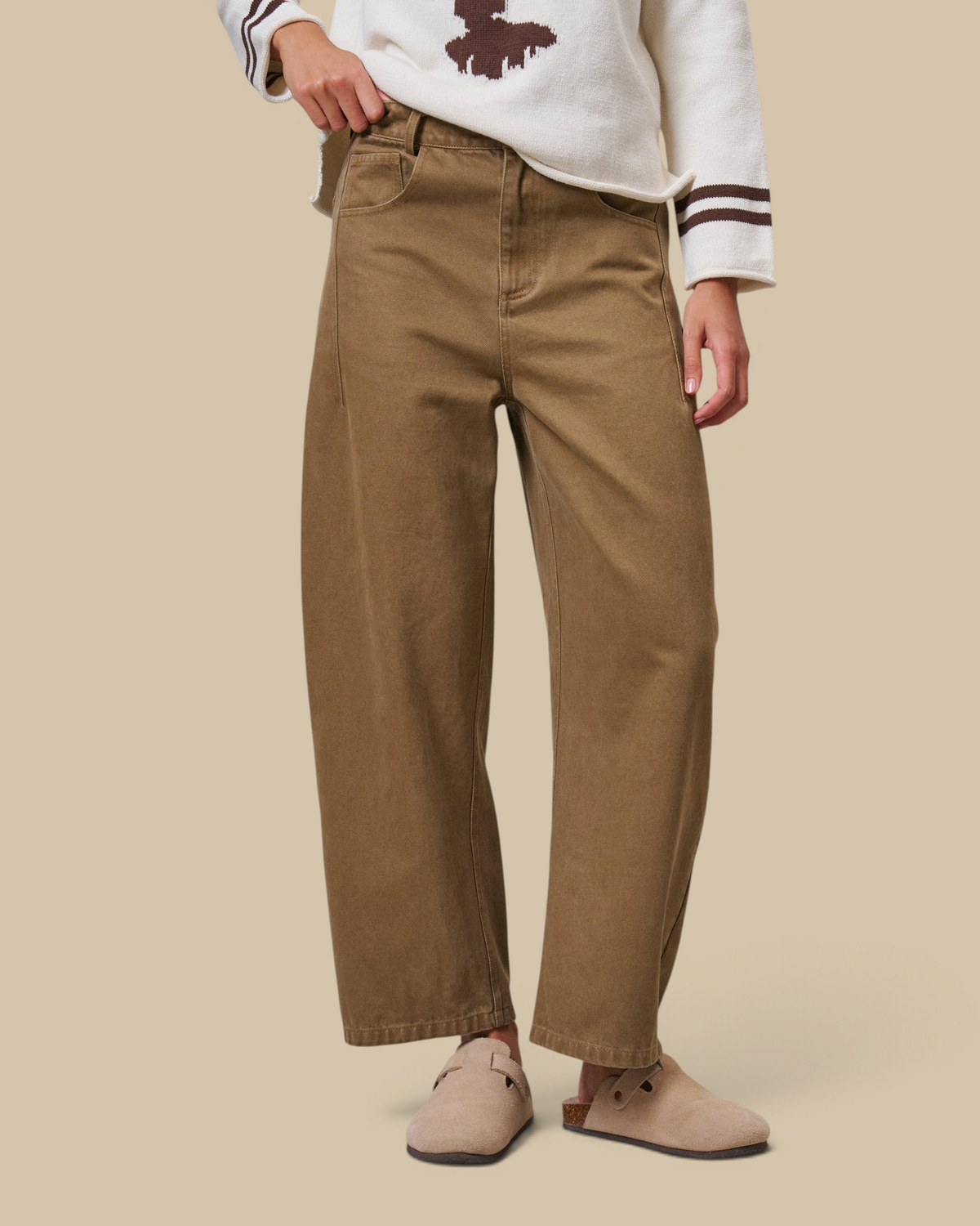 Homestyle Collective tan cotton barrel leg pants with a high-rise waist and cropped ankle on a model.