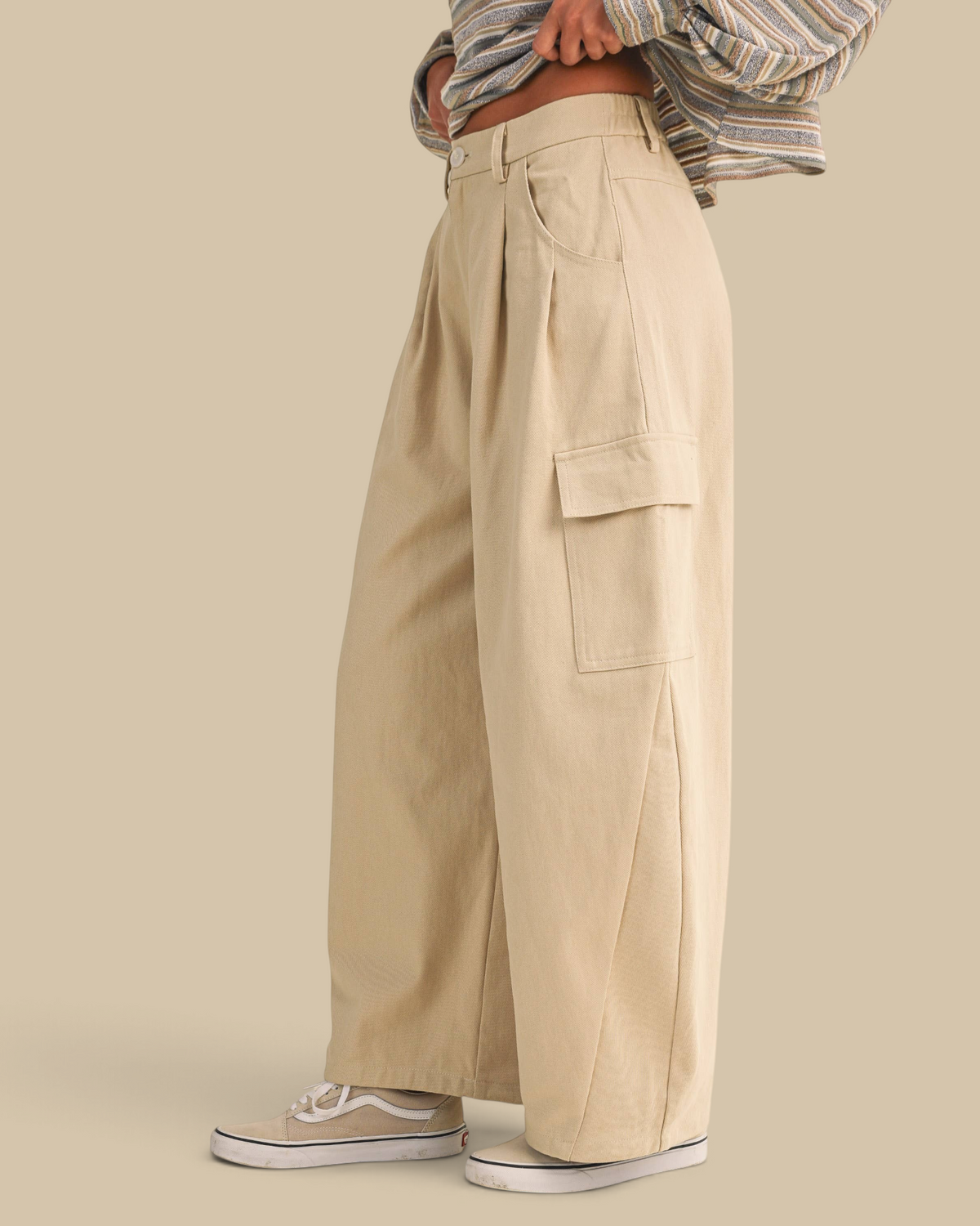 Homestyle Collective beige cotton twill cargo barrel pants with a high-waisted, wide-leg fit and side pockets.