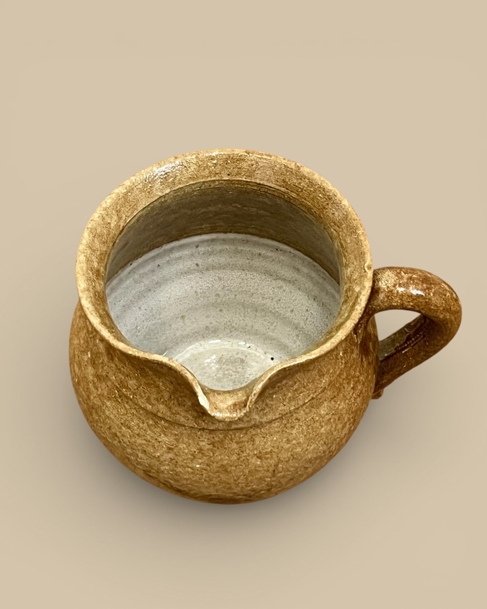 Stamped Hand Spun Pottery Pitcher