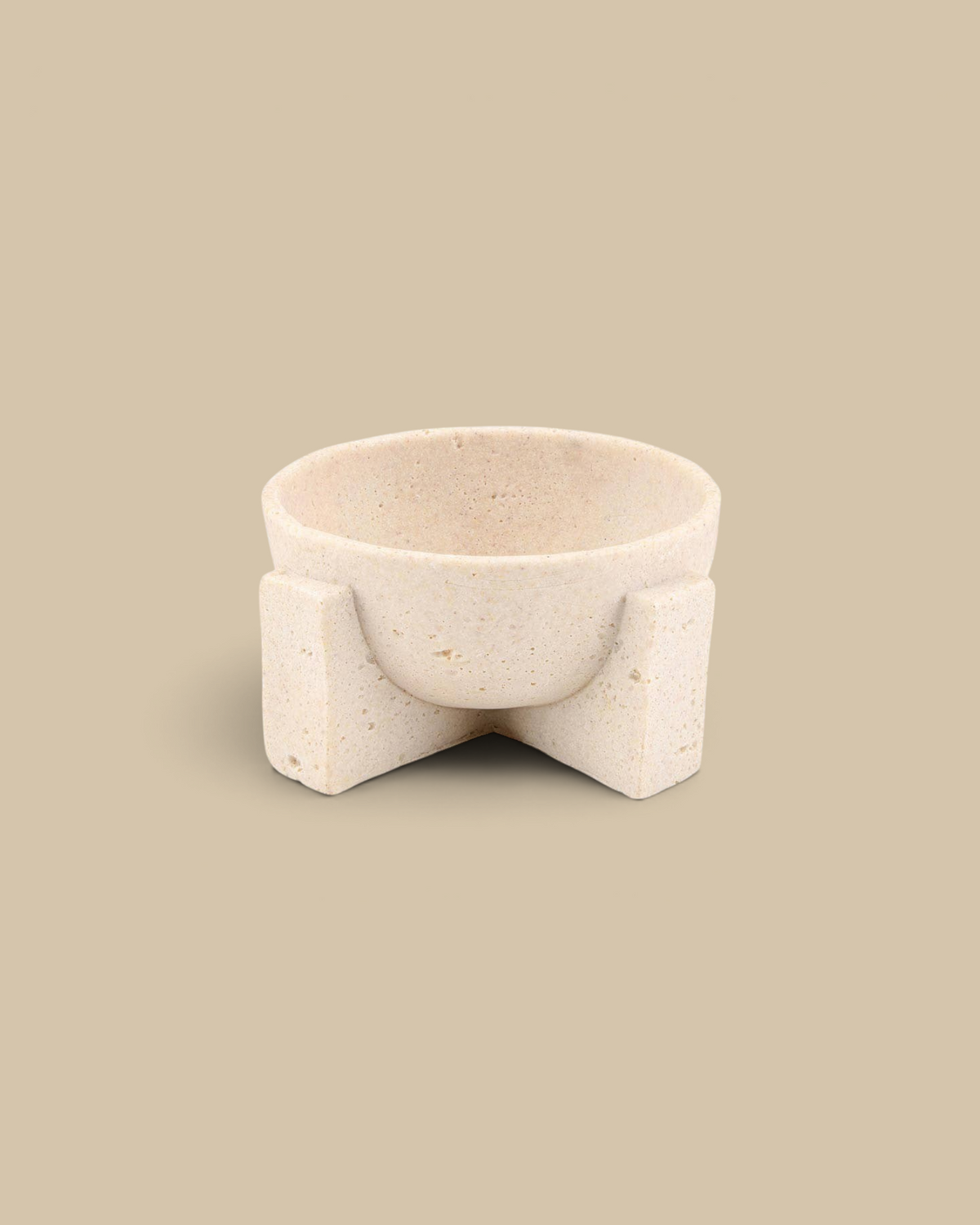 Homestyle Collective textured bowl in a beige organic stone finish with a sculptural pedestal base.
