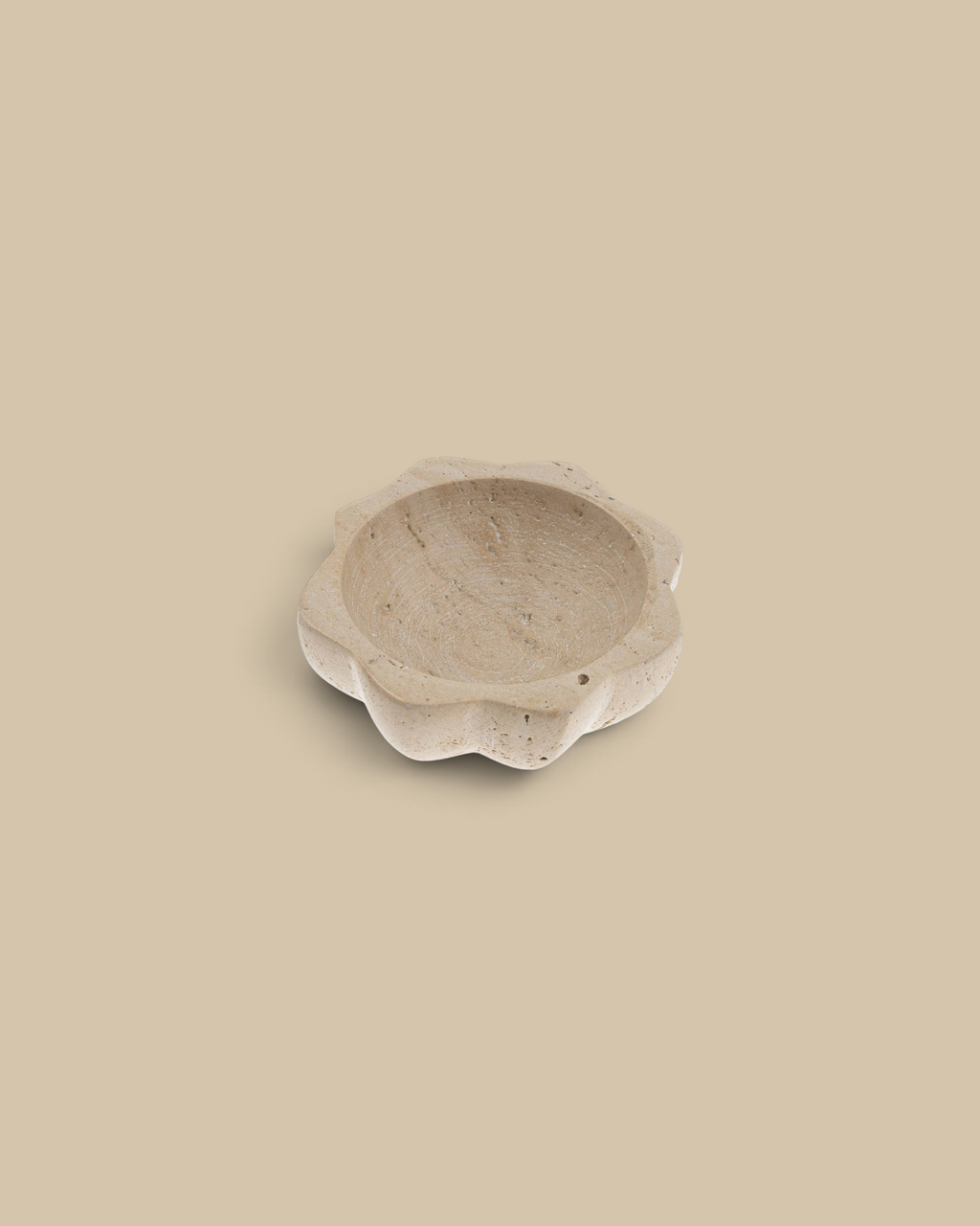 Homestyle Collective lotus-shaped salt bowl carved from natural beige travertine stone for kitchen spices