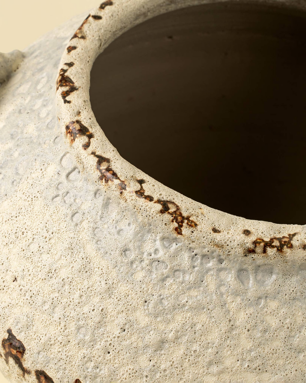 Homestyle Collective Terra Terracotta Vase with a weathered, textured cream finish and rustic brown rim details.