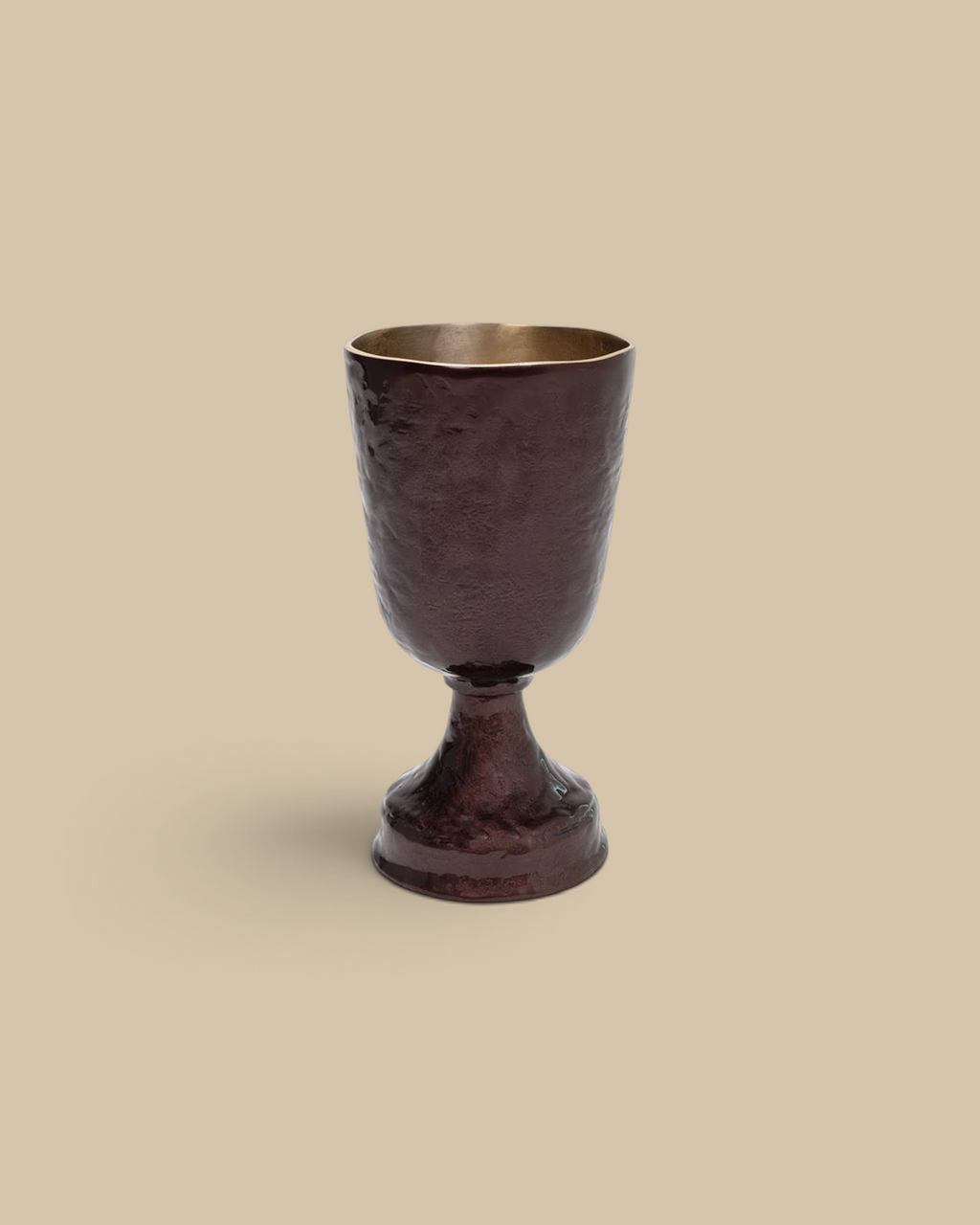 Homestyle Collective Verlix short urn in bronze aluminum with a textured handcrafted surface and elegant pedestal base.
