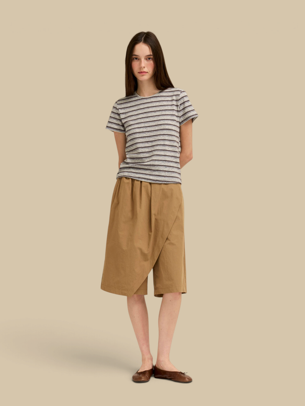 Model wearing a Homestyle Collective light grey striped jersey tee with short sleeves and a round neck.