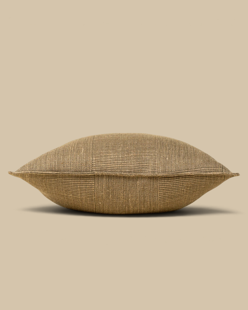 Homestyle Collective olive green 20x20 patch weave linen pillow with flange detail on a neutral background.