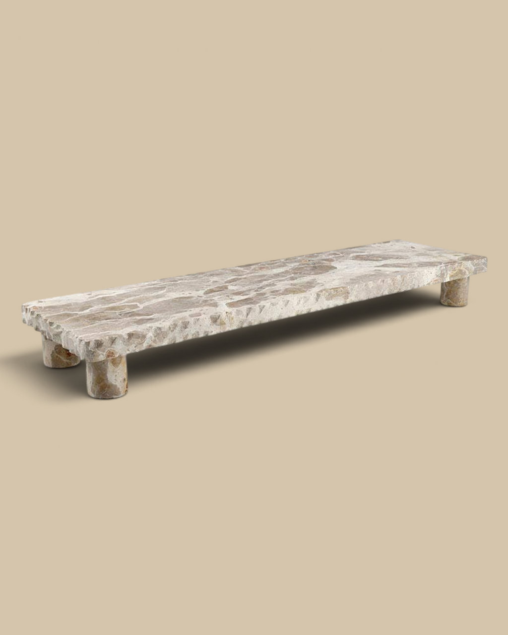 Homestyle Collective beige marble pedestal stand with natural veining and a smooth rectangular surface.