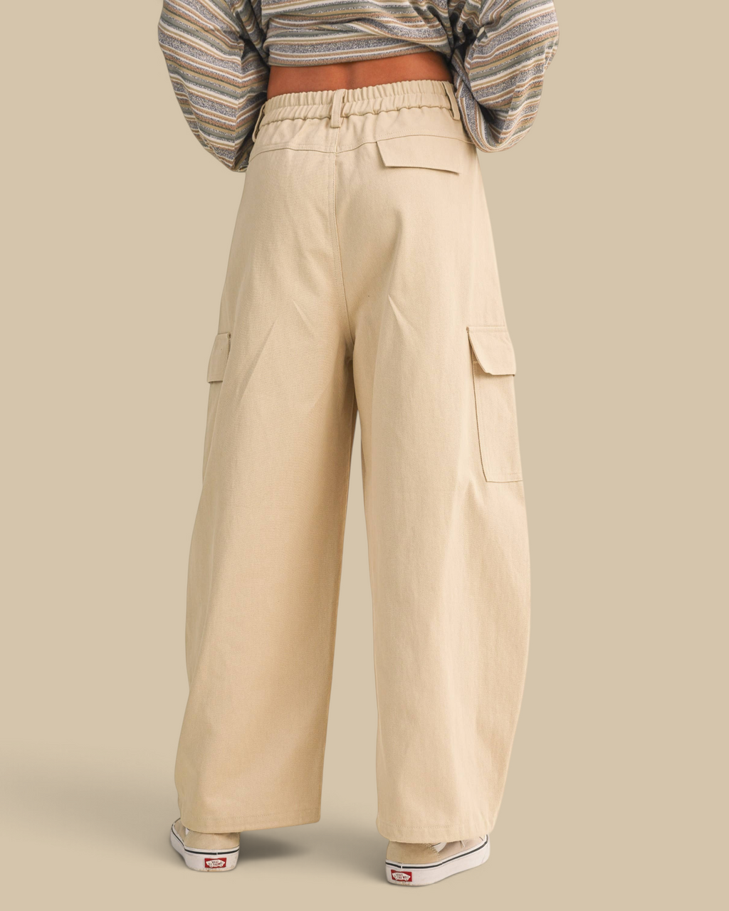 Homestyle Collective beige cotton twill cargo barrel pants with a high-waisted wide-leg fit, back view.
