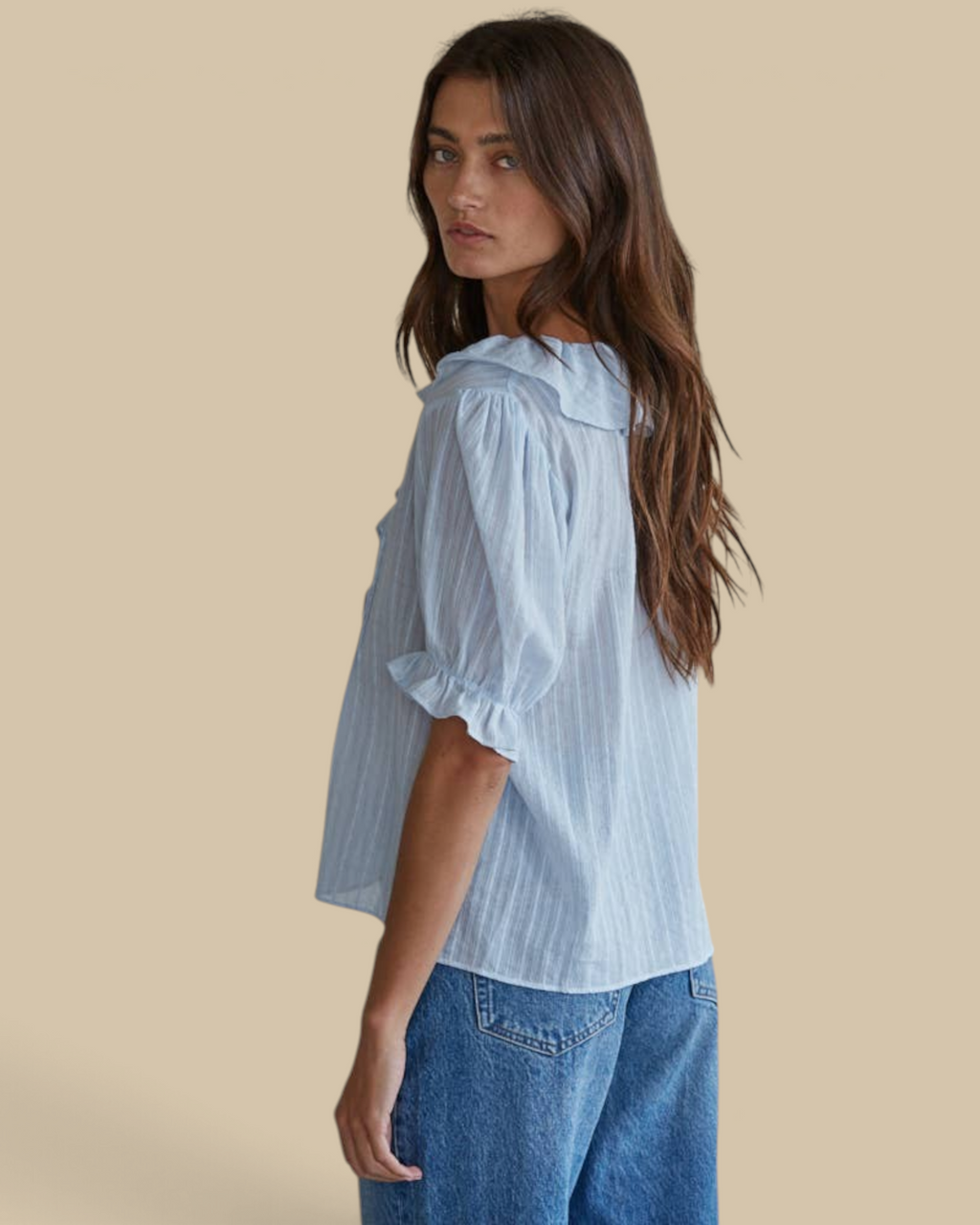 Homestyle Collective powder blue cotton blouse with ruffle collar and pintuck details worn by a model